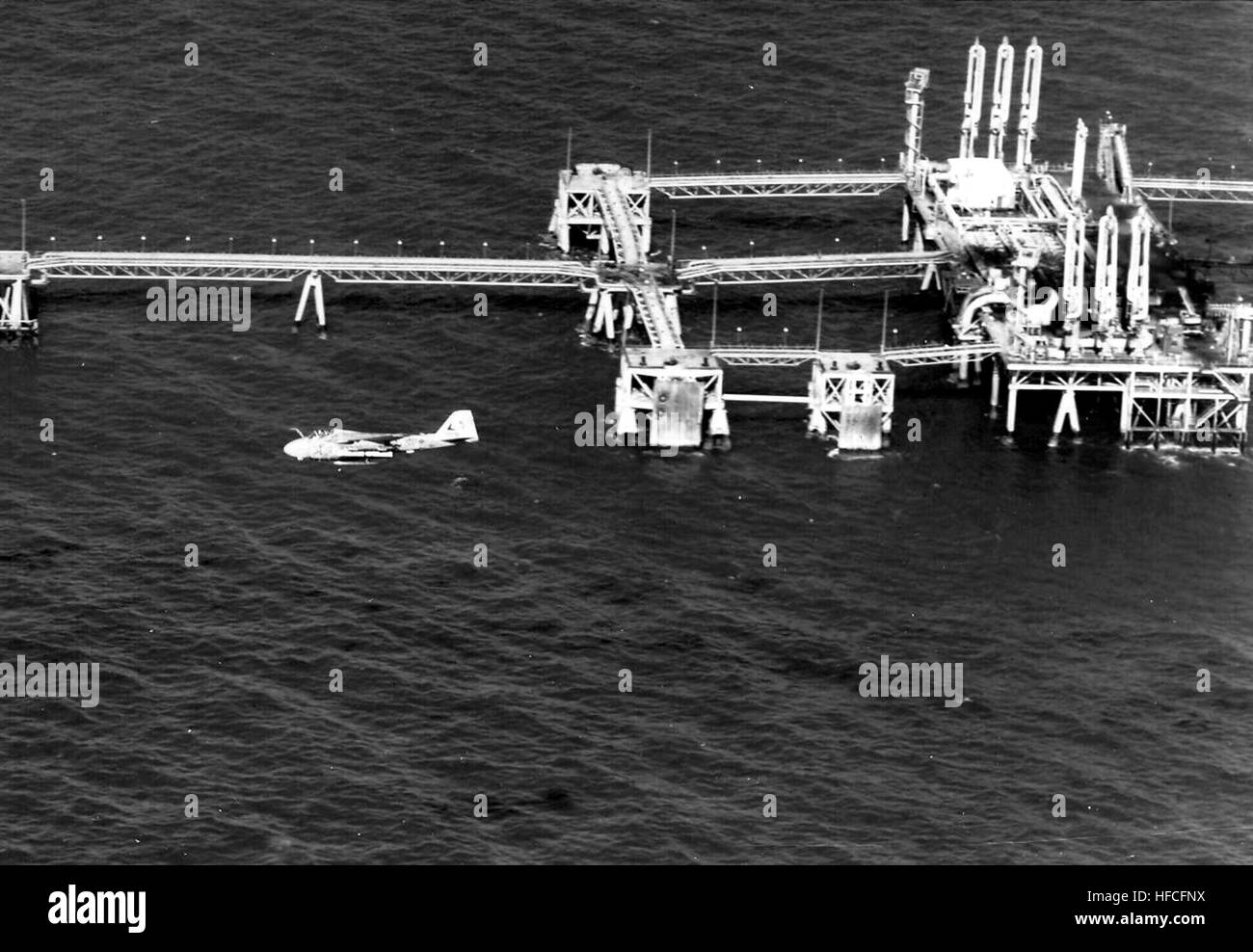 A-6E Intruder of VA-115 over destroyed Iraqi oil platform 1991 Stock Photo