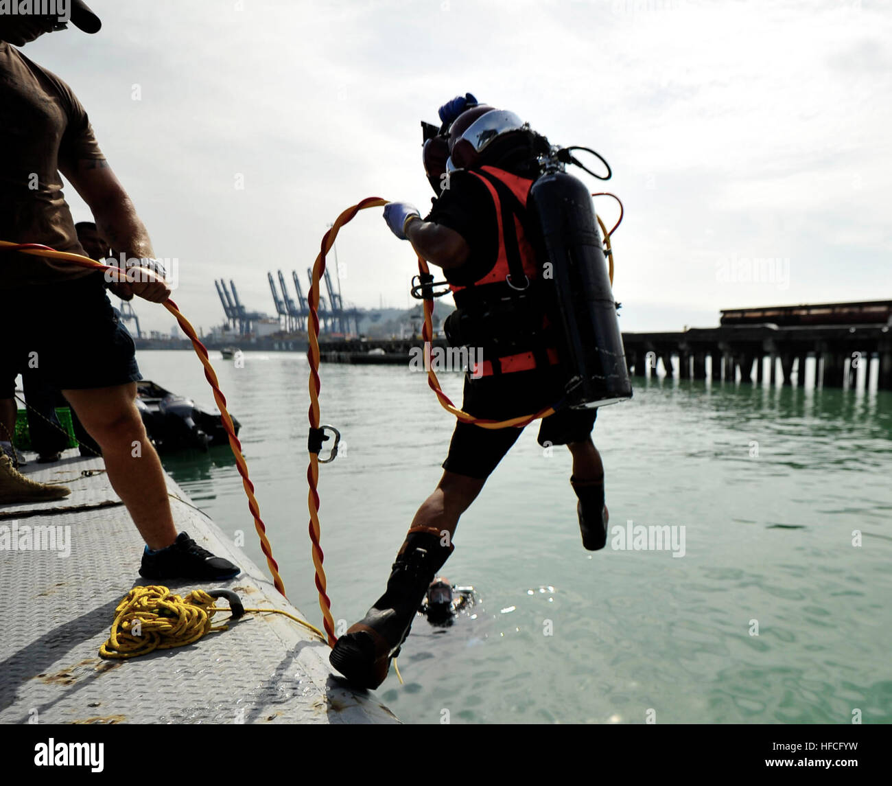A Panamanian navy diver performs a front step water entry during a ...