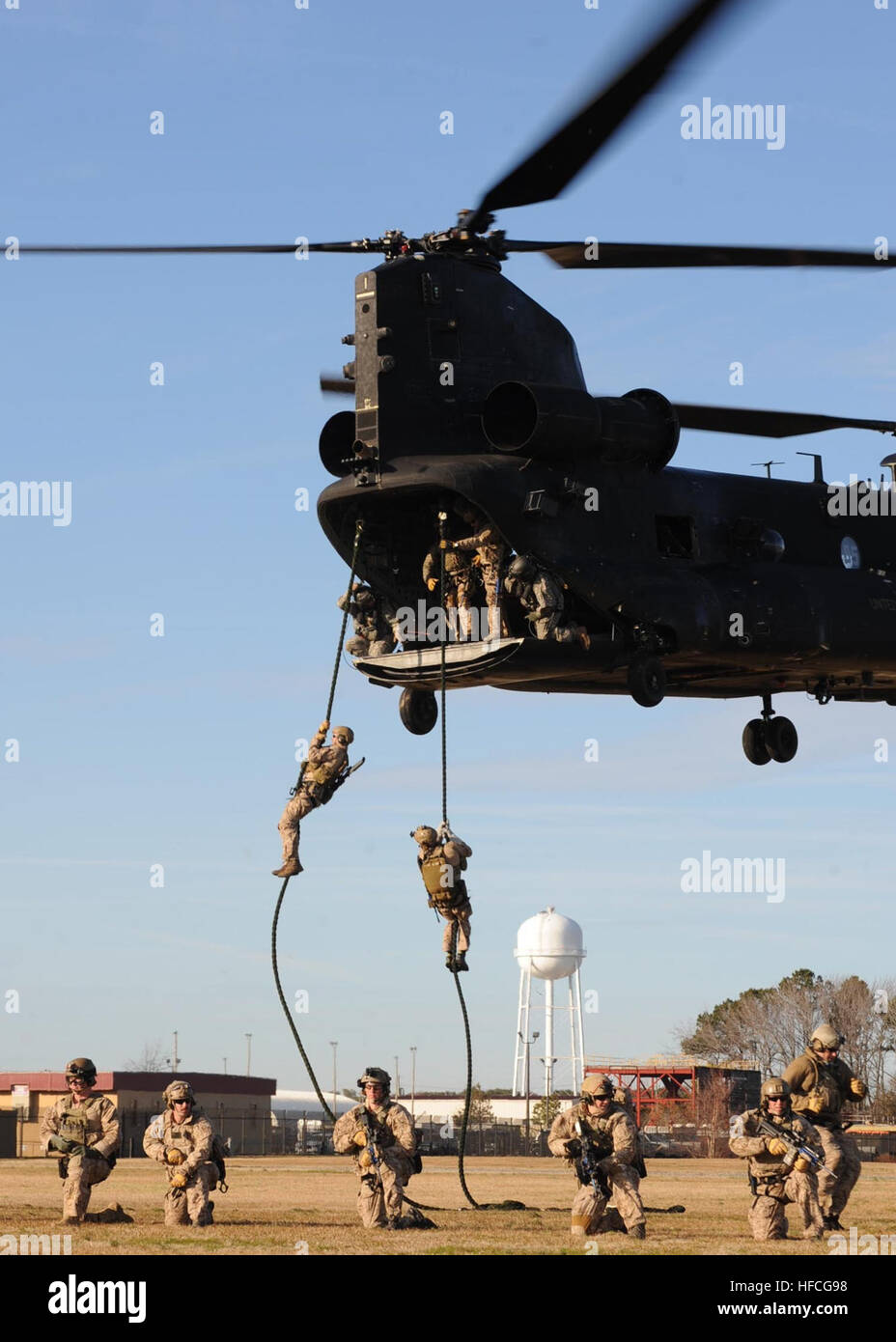 East Coast-based Navy SEALs fast rope during a training evolution on Joint  Expeditionary Base Little Creek-Fort Story Jan. 10. Fast roping is an asset  SEALs utilize for quick insertion and when a