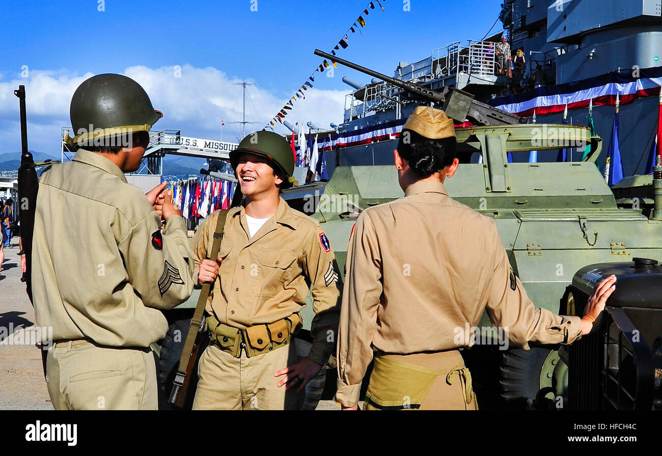 Members of the Hawaii Historic Arms Association honor veterans at the Battleship Missouri Memorial during a Veterans Day ceremony dedicated to America's Nisei. The second-generation, U.S.-born Japanese-American soldiers served during World War II in the 100th Infantry Battalion, 442nd Regimental Combat Team, Military Intelligence Service, and 1399th Engineer Construction Battalion. The ceremony signaled the opening of a special exhibit aboard the Battleship Missouri Memorial honoring the service and bravery of America's Nisei soldiers. (U.S. Navy photo by Mass Communication Specialist 3rd Clas Stock Photo