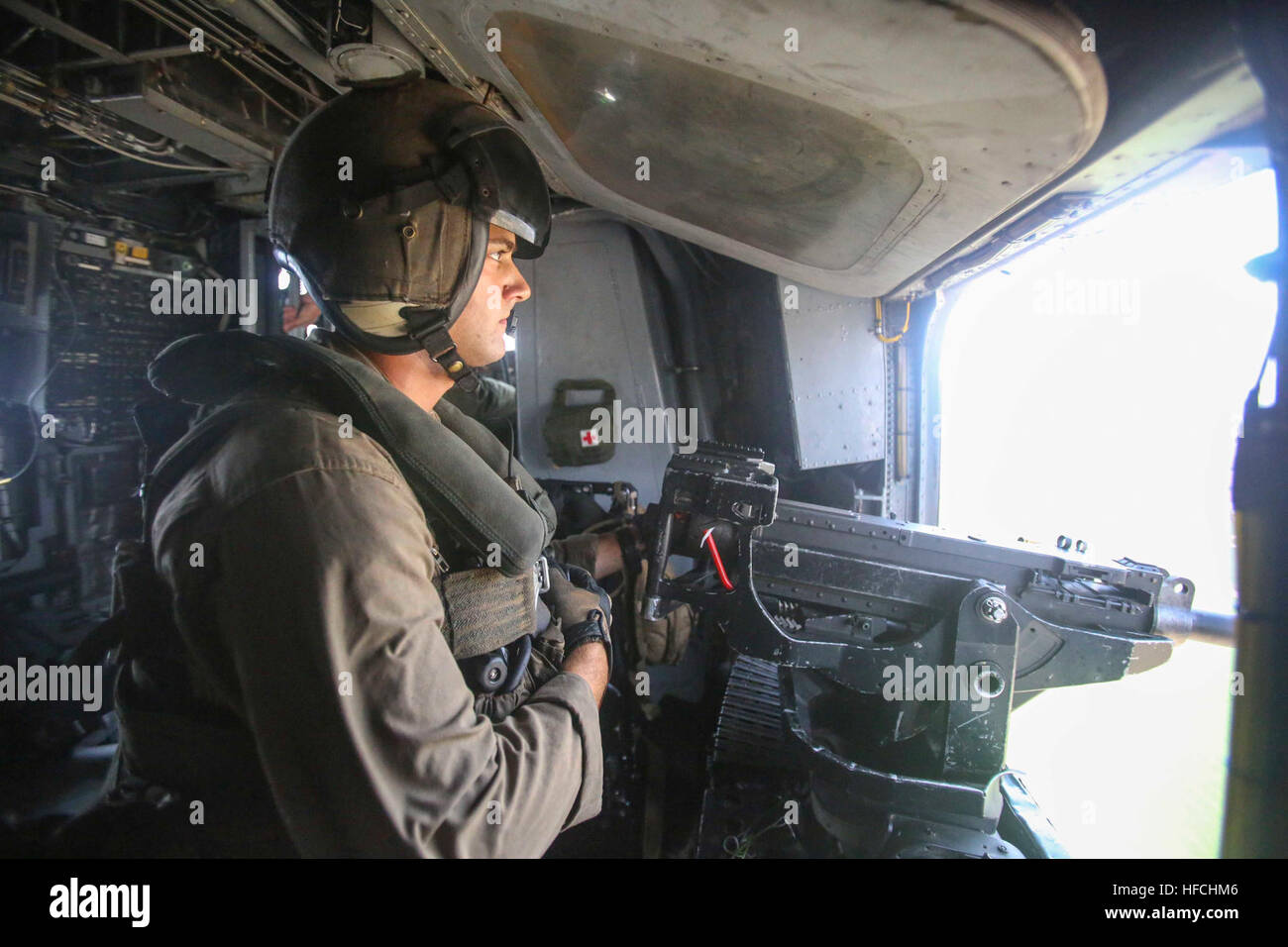 160720-M-KK554-008 ISRAEL DEFENSE FORCES NATIONAL TRAINING CENTER, Israel (July 20, 2016) A U.S. Marine with Marine Medium Tiltrotor Squadron 264 (Reinforced), 22nd Marine Expeditionary Unit (MEU), scans for targets with a GAU-21 .50-caliber machine gun inside a CH-53E Super Stallion helicopter July 20, 2016, during Noble Shirley 16, a bilateral training exercise with the Israel Defense Forces. 22nd MEU, deployed with the Wasp Amphibious Ready Group, is conducting naval operations in the U.S. 6th fleet area of operations in support of U.S. national security interests in Europe. (U.S. Marine Co Stock Photo