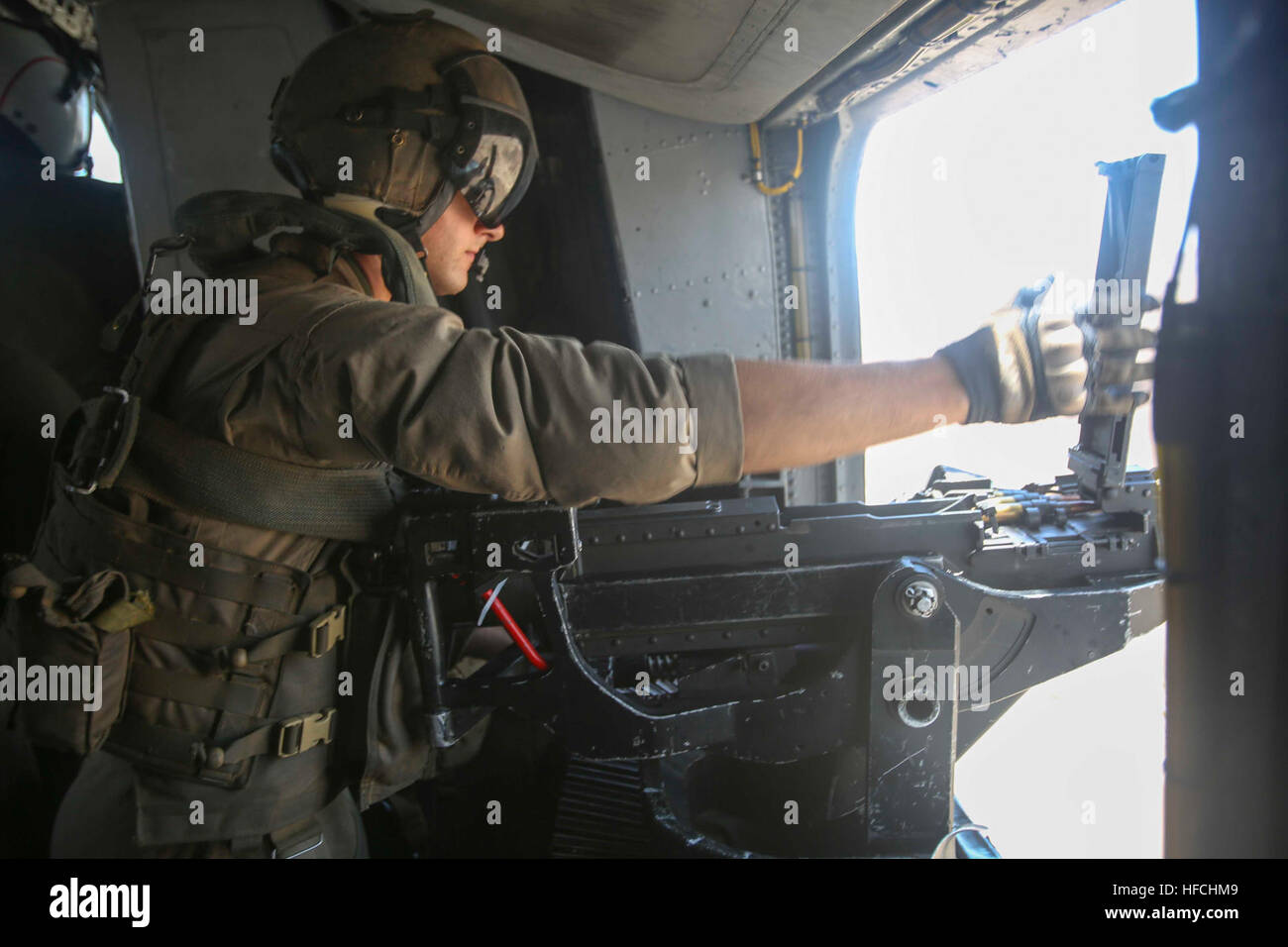 160720-M-KK554-062 ISRAEL DEFENSE FORCES NATIONAL TRAINING CENTER, Israel (July 20, 2016) A U.S. Marine with Marine Medium Tiltrotor Squadron 264 (Reinforced), 22nd Marine Expeditionary Unit (MEU) reloads his GAU-21 .50-caliber machine gun inside a CH-53E Super Stallion helicopter July 20, 2016, during Noble Shirley 16, a bilateral training exercise with the Israel Defense Forces. 22nd MEU, deployed with the Wasp Amphibious Ready Group, is conducting naval operations in the U.S. 6th fleet area of operations in support of U.S. national security interests in Europe. (U.S. Marine Corps photo by S Stock Photo