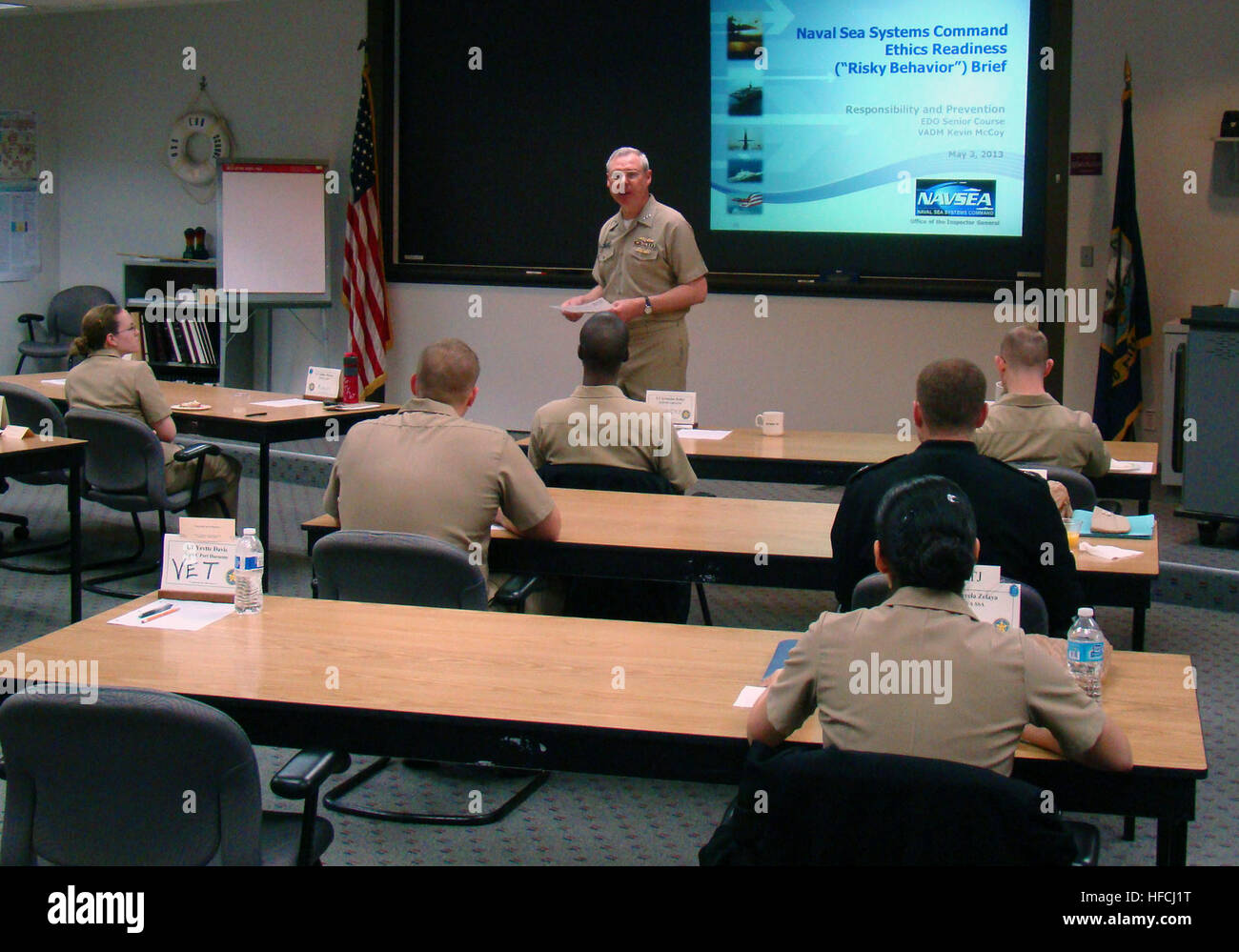 Vice Adm. Kevin McCoy, commander of Naval Sea Systems Command and the Navy's senior engineering duty officer, discusses with Engineering Duty Officer School students how EDOs are the Navy's guardians of technical compliance and excellence. (U.S. Navy photo by Lt. Cmdr. Richard Jones/Released) NSSC commander talks with students 130502-N-ZZ999-001 Stock Photo