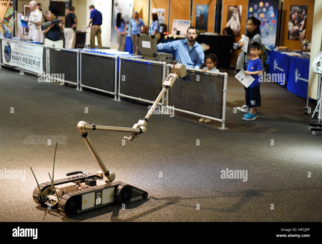 150522-N-PO203-068 NEW YORK  (May 22, 2015) Aaron O'Toole, a robotics engineer at the Naval Surface Warfare Center Indian Head, demonstrates an Explosive Ordnance Disposal (EOD) PackBot at the New York Hall of Science in Queens, N.Y., as part of the Office of Naval Research (ONR) / U.S. Naval Research Laboratory (NRL) student outreach during Fleet Week New York (FWNY). (U.S. Navy photo by John F. Williams/Released) ONR at FWNY 150522-N-PO203-068 Stock Photo