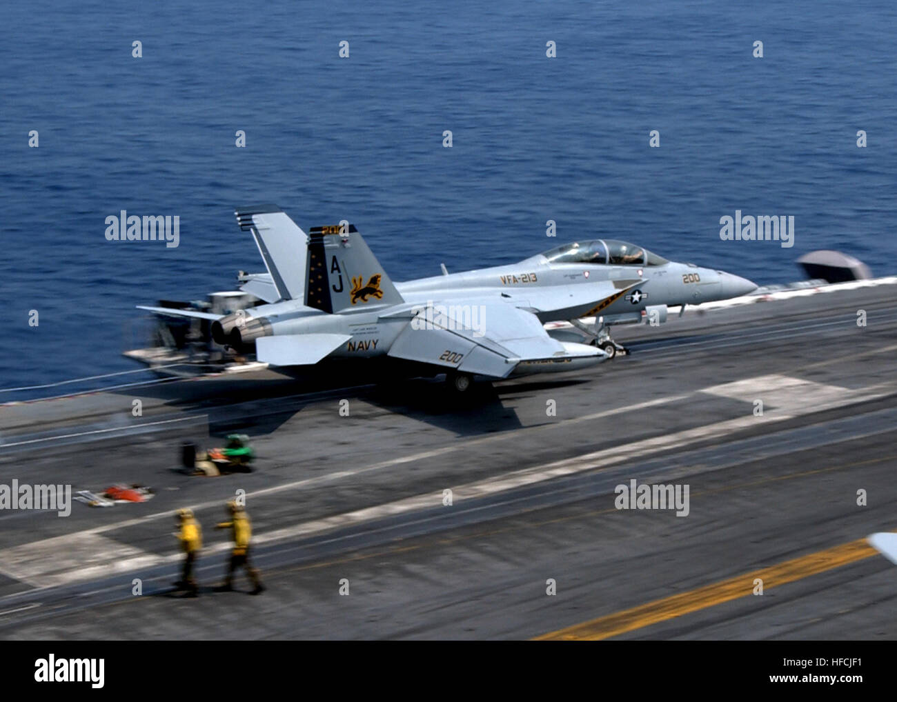 An F/A-18E Super Hornet assigned to the 'Blacklions' of Strike Fighter Squadron 213 launches from the flight deck of the Nimitz-class aircraft carrier USS Theodore Roosevelt. The Theodore Roosevelt Carrier Strike Group is participating in Joint Task Force Exercise 'Operation Brimstone' off the Atlantic coast. On the edge of launching 105534 Stock Photo