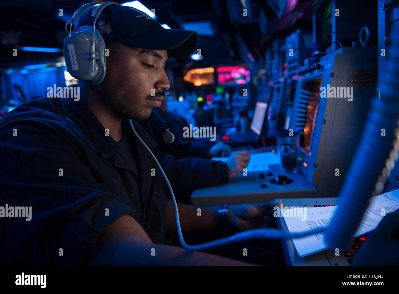 Fire Controlman operates the Close-In Weapons System (CIWS) aboard USS ...