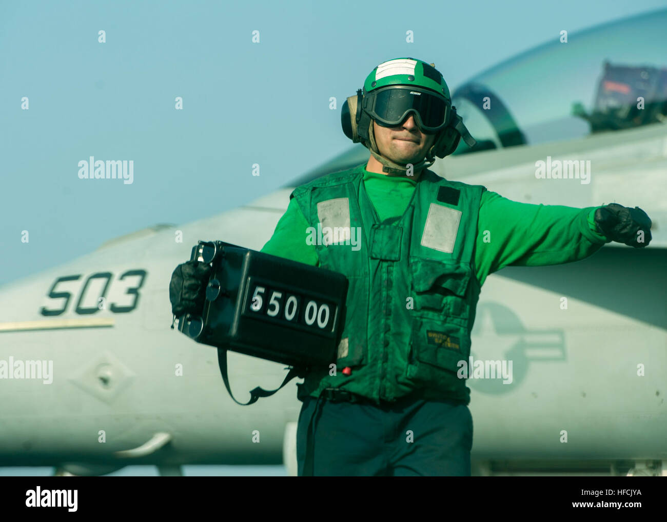 Aviation Boatswain’s Mate (Equipment) Airman Juan Millian displays the