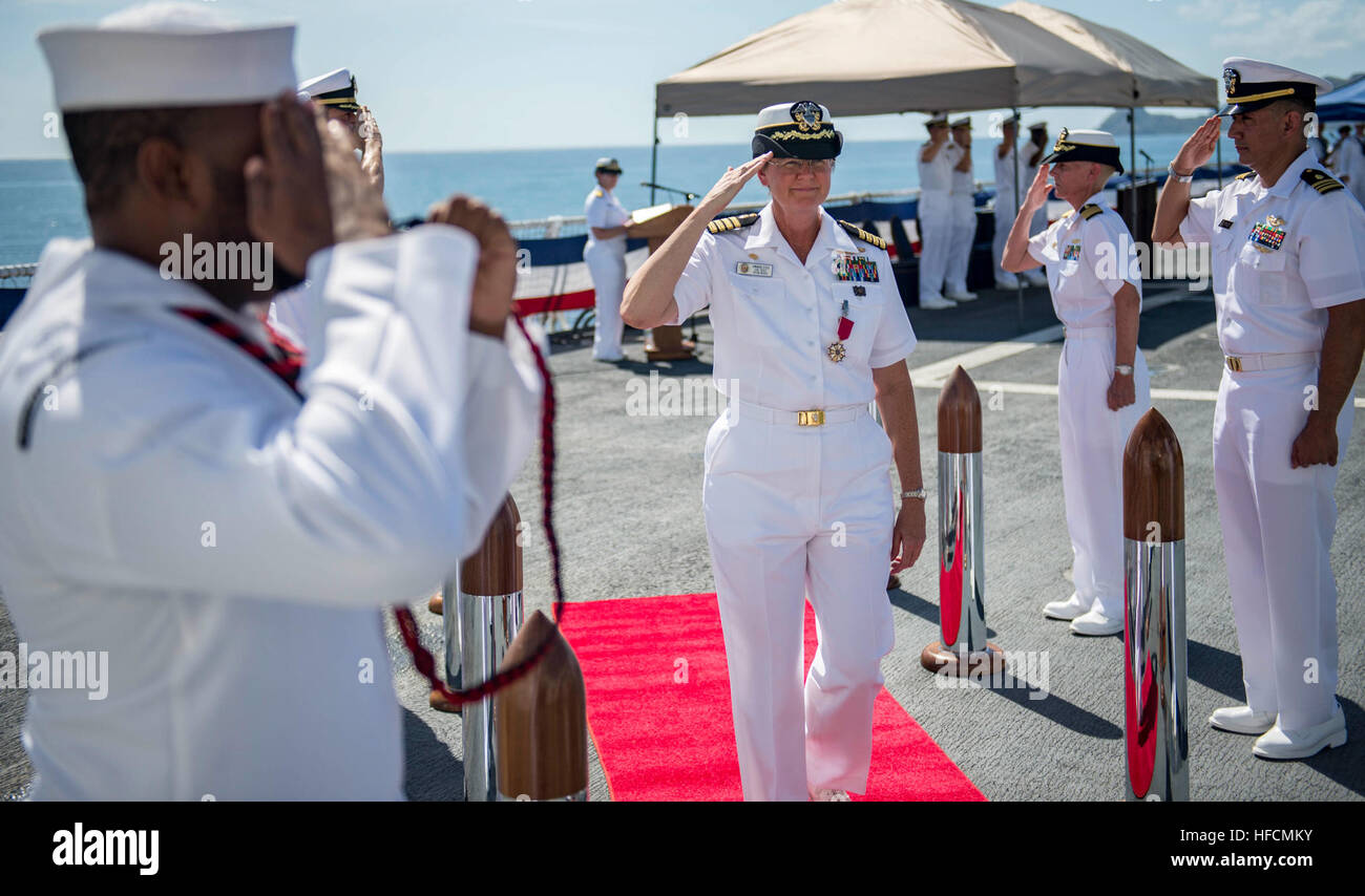 160616-N-QW941-238 DILI, Timor Leste (June 16, 2016) Capt. Melanie Merrick salutes the side boys after a change of command ceremony aboard USNS Mercy (T-AH 19). Mercy is currently in Timor Leste supporting Pacific Partnership 2016. This year marks the sixth time the mission visited Timor Leste since its first visit in 2006. Medical, engineering and various other personnel embarked aboard Mercy are working side-by-side with partner nation counterparts, exchanging ideas, building best practices and relationships to ensure preparedness should disaster strike. (U.S. Navy photo by Mass Communicatio Stock Photo