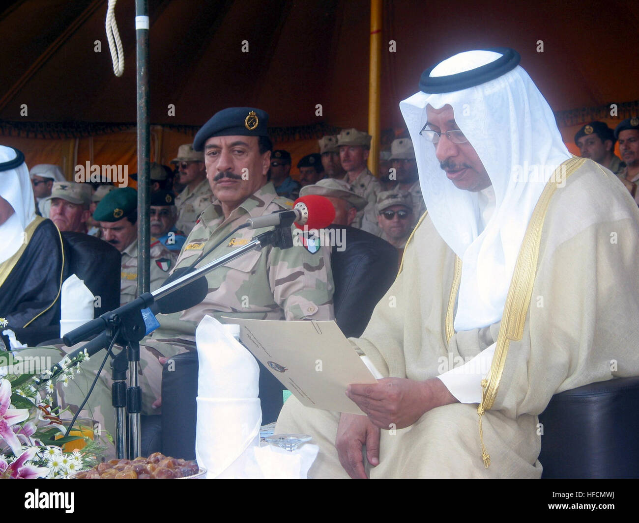 030507-N-1050K-019  Camp Patriot, Kuwait (May 7, 2003) -- From left, Kuwait’s Armed forces Chief of Staff, Lt. Gen Fahad al-Amir listens to a speech by Kuwait’s Defense Minister Sheikh Jaber al-Mubarak al-Sabah during the Sheikh’s recent visit to Kuwait Naval Base and Camp Patriot.  Sheikh al-Sabah bid Gulf Country Council (GCC) troops participating in Peninsula Shield farewell and thanks during a brief visit and ceremony attended by hundreds of area commanders and troops from the GCC states as well as U.S., British and Australian military leaders. The GCC is made up of members from the nation Stock Photo