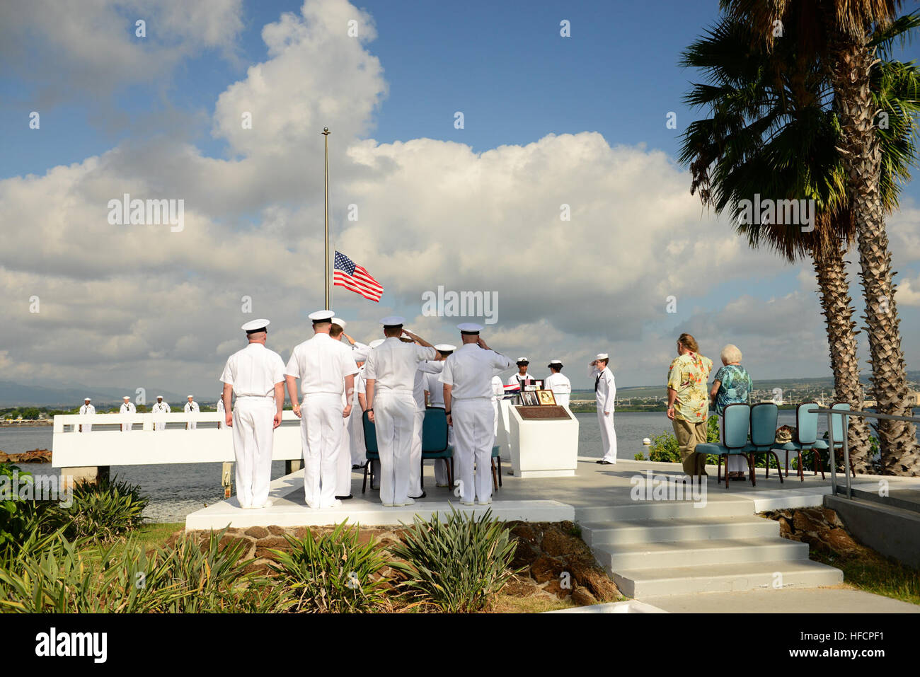 PEARL HARBOR (Jan. 27, 2016) Family members and military guests of the late Pearl Harbor survivor Coxswain John S. Pidcock attend an ash-scattering ceremony at the USS Utah Memorial on Ford Island, Joint Base Pearl Harbor-Hickam. Pidcock was stationed aboard the USS Tangier (AV-8) during the 1941 Japanese attacks on Pearl Harbor. His ashes, along with his wife Bonnie’s ashes, joined the remains of the Sailors still aboard USS Utah, which was sunk during the 1941 attacks. (U.S. Navy photo by Mass Communication Specialist 1st Class Meranda Keller/ Released) Pearl Harbor Survivor Remembered 16012 Stock Photo