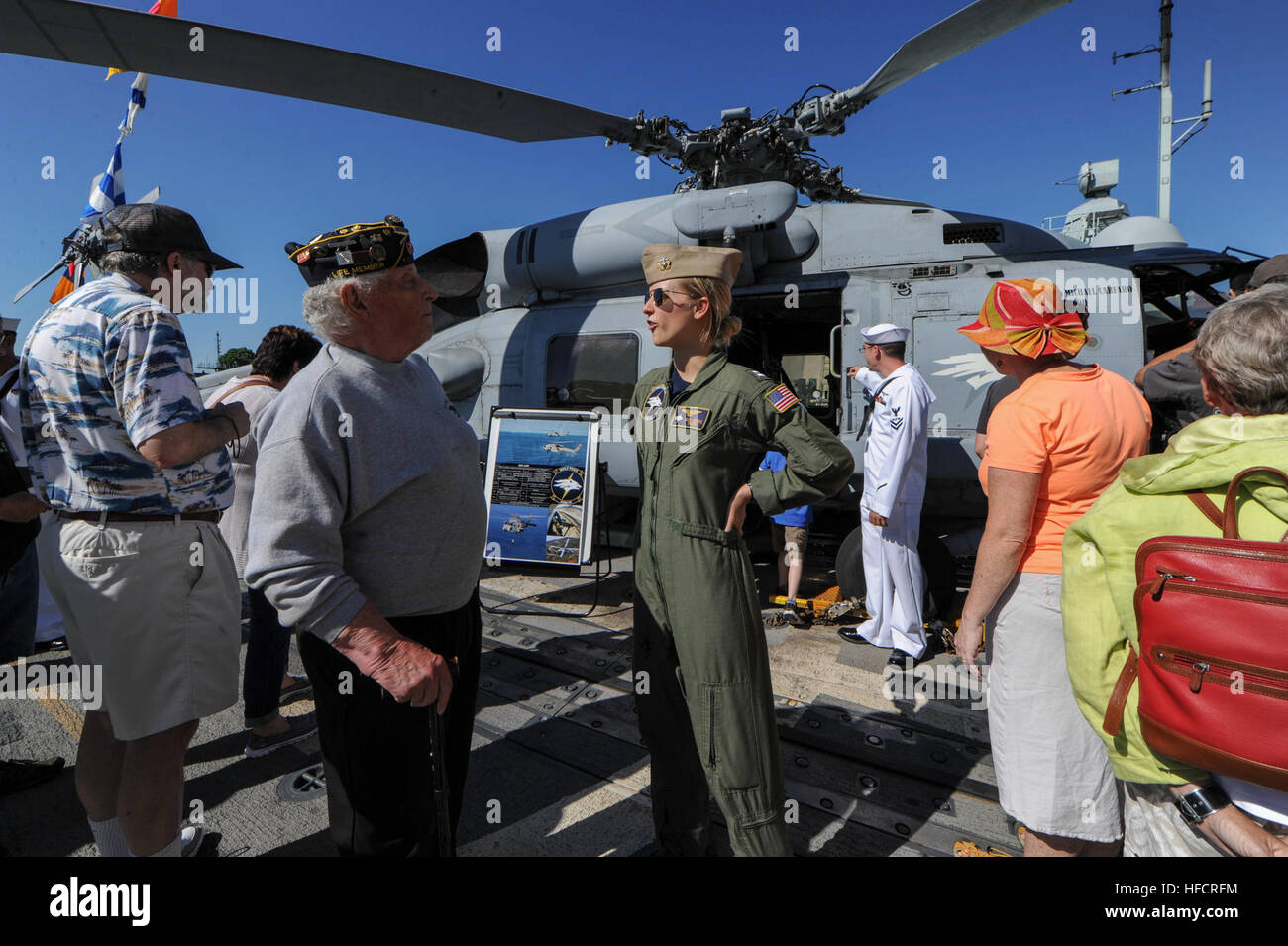 150606-N-OO032-006 PORTLAND, Ore. (June 5, 2015) Lt. Jessica Joses, a Burbank, Calif., native assigned to Helicopter Maritime Strike Squadron 75 (HSM 75), discusses her job as an aviator with a Navy veteran as part of a tour aboard USS Cape St. George (CG 71) during Portland Fleet Week and the 106th annual Rose Festival. The festival and Portland Fleet Week are a celebration of the sea services, with Sailors, Marines and Coast Guardsmen from the U.S. and Canada making the city a port of call. (U.S. Navy Photo by Mass Communication Specialist 2nd Class Cory Asato/Released) Portland Fleet Week t Stock Photo