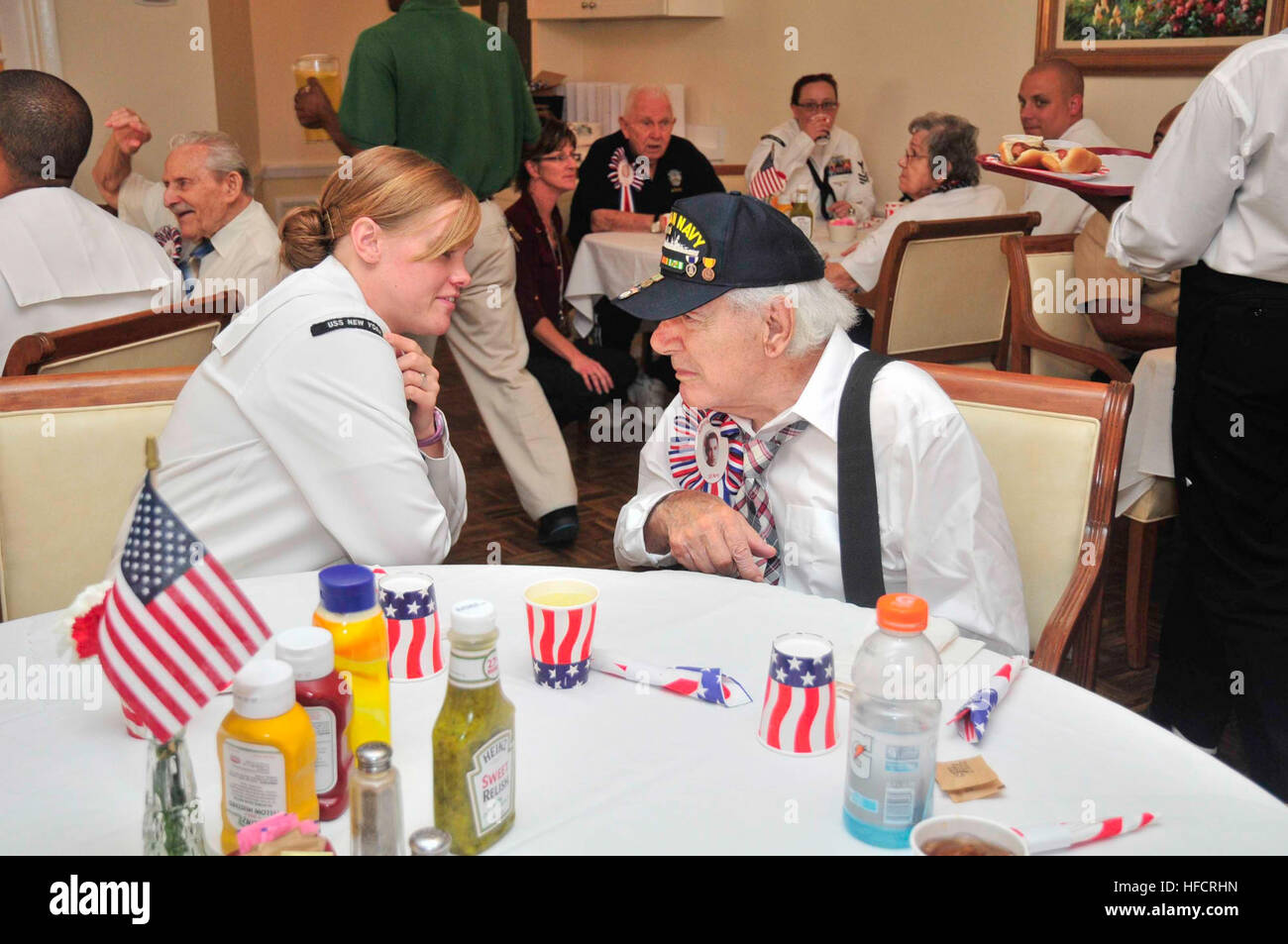 Sailors from the amphibious transport dock ship USS New York (LPD 21) interact with veterans during a Salute to Veterans luncheon as part of Fleet Week Port Everglades. This is the 24th annual Fleet Week in Port Everglades, South Florida's annual celebration of the maritime services. (U.S. Navy photo by Mass Communication Specialist 2nd Class Cyrus Roson/Released) Port Everglades Fleet Week 2014 140430-N-YO707-307 Stock Photo