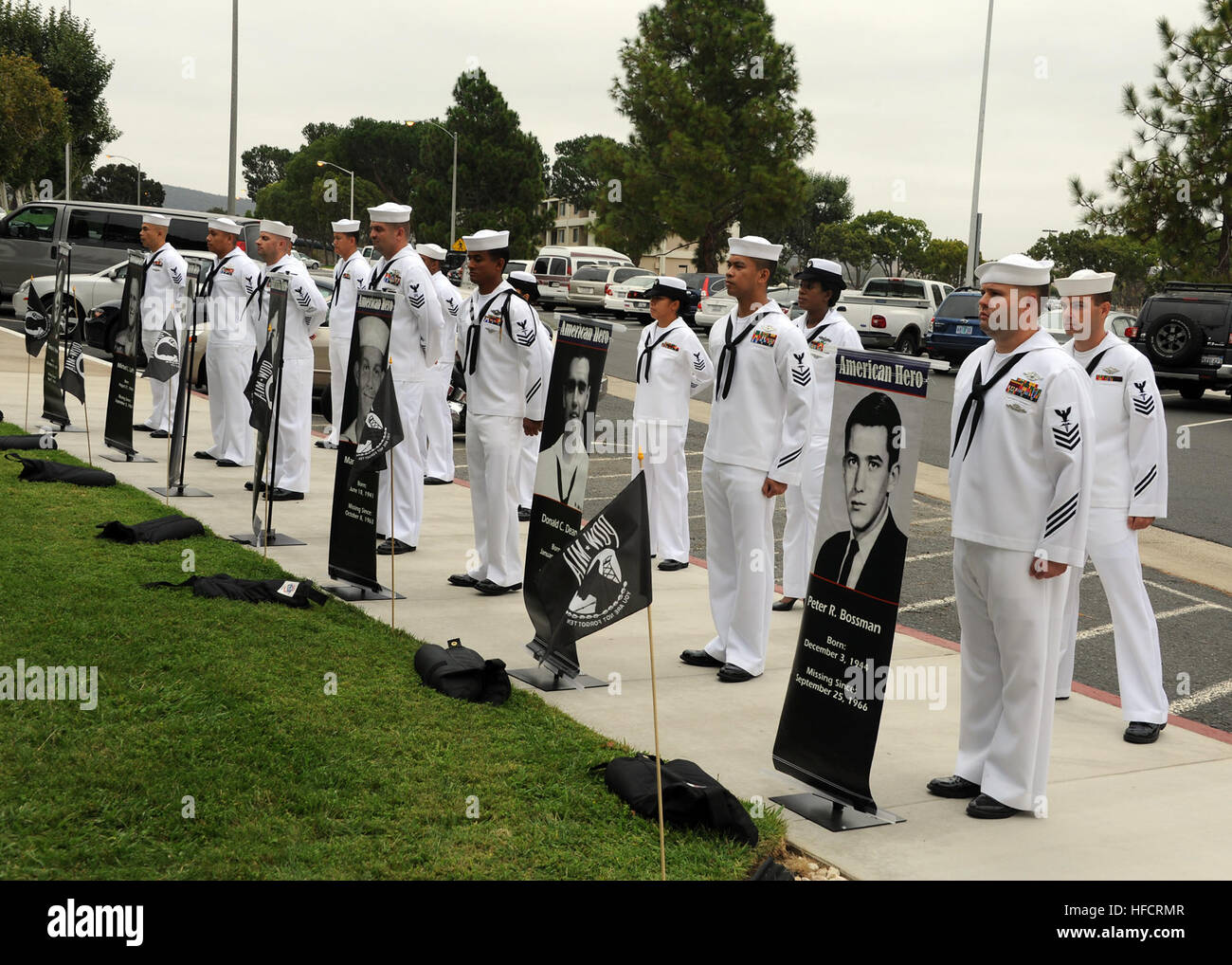 Sailors from the Naval Hospital Camp Pendleton 1st Class Petty Officers Association display the names and portraits of seven Navy hospital corpsmen still missing from the Vietnam War during a service of remembrance at the Prisoner of War/Missing in Action (POW/MIA) Memorial on National POW/MIA Recognition Day. Naval Hospital Camp Pendleton held its 23nd annual POW/MIA Remembrance Ceremony on the front lawn of the hospital at the POW/MIA memorial site. (U.S. Navy photo by Mass Communication Specialist 1st Class Michael R. McCormick/Released) POW-MIA service 130920-N-HJ915-155 Stock Photo