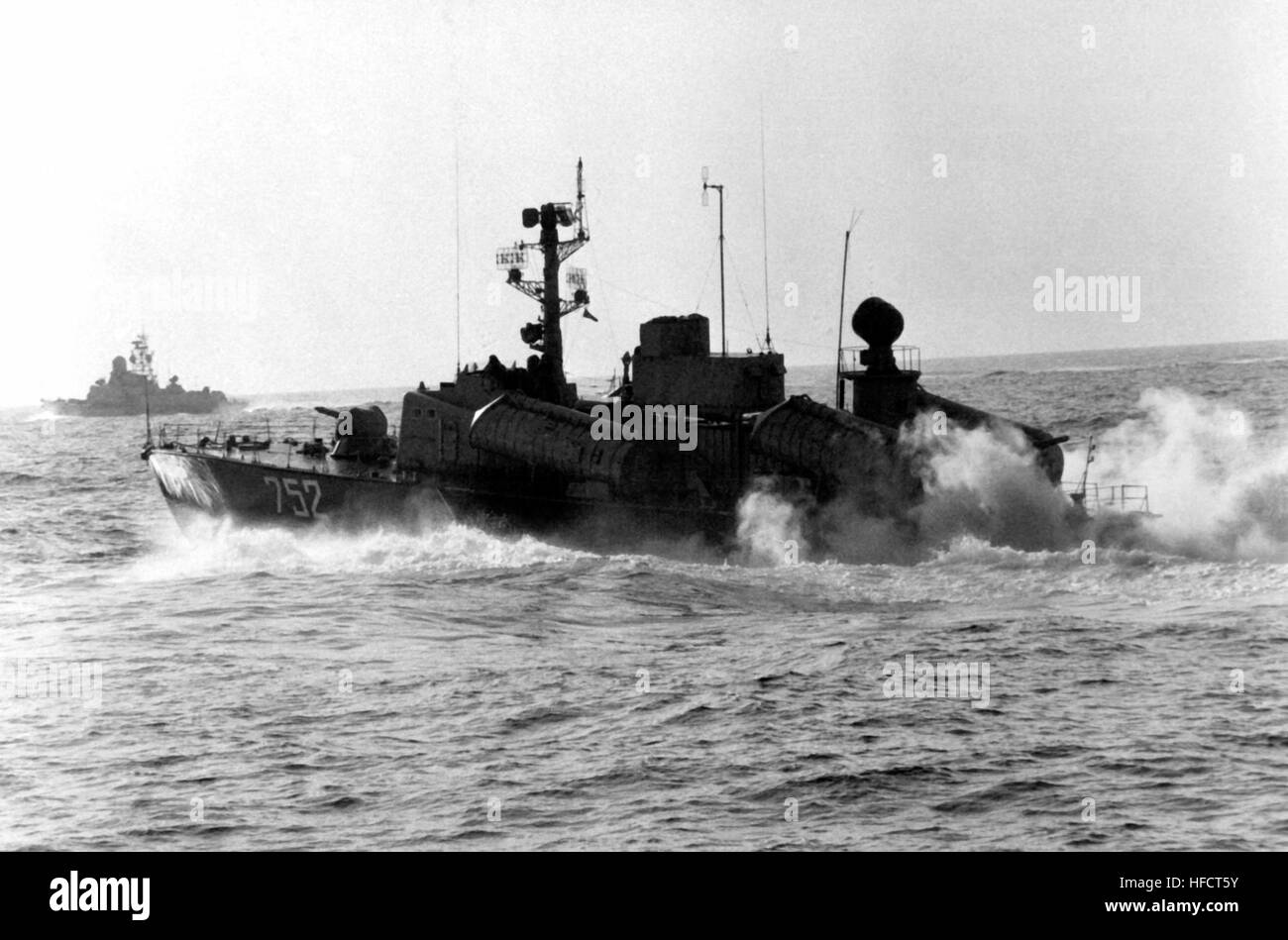 A port beam view of a Soviet Osa II fast attack craft armed with Styx missiles underway.  In the background is a Soviet Nanuchka II. Projects 205-U and 1234-E missile ships - May 1982 Stock Photo