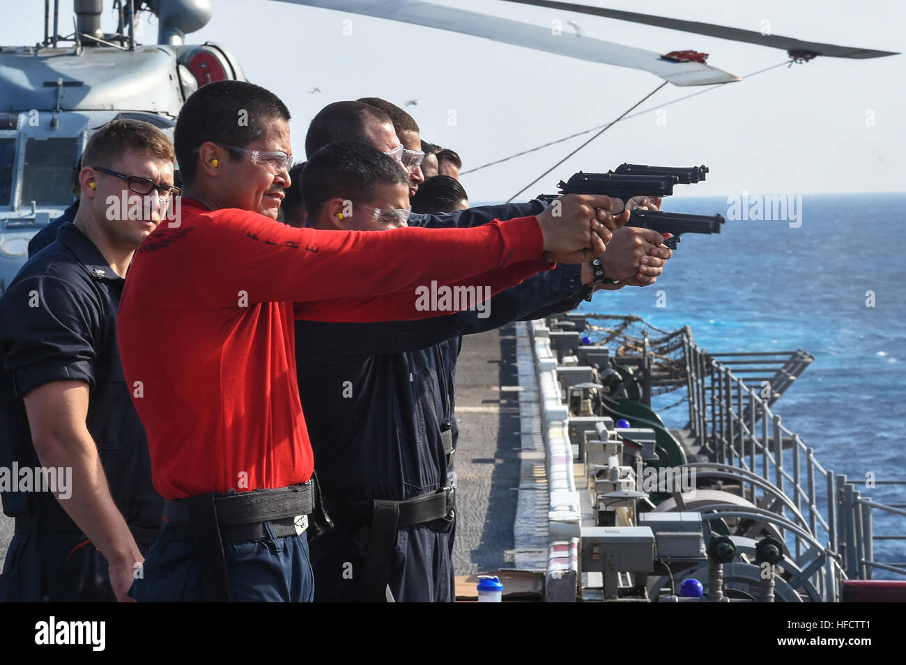 Sailors aboard the amphibious assault ship USS Peleliu (LHA 5) conduct ...