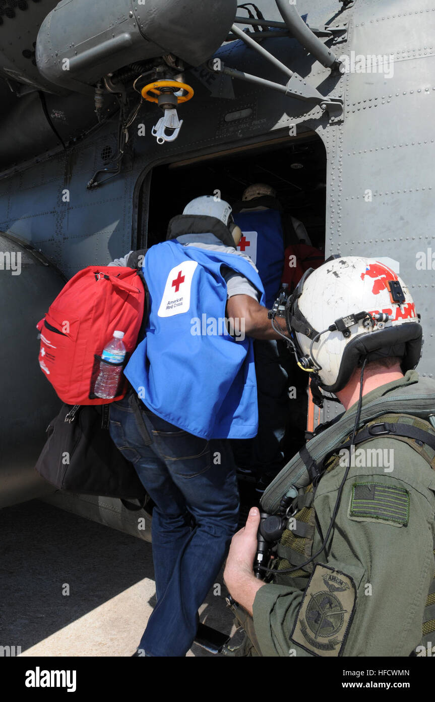 GUANTANAMO BAY, Cuba – American Red Cross volunteers board an MH-35E Sea  Dragon helicopter bound for Haiti at U.S. Naval Station Guantanamo Bay  airfield, Jan. 22, 2010. Service members from the Navy's