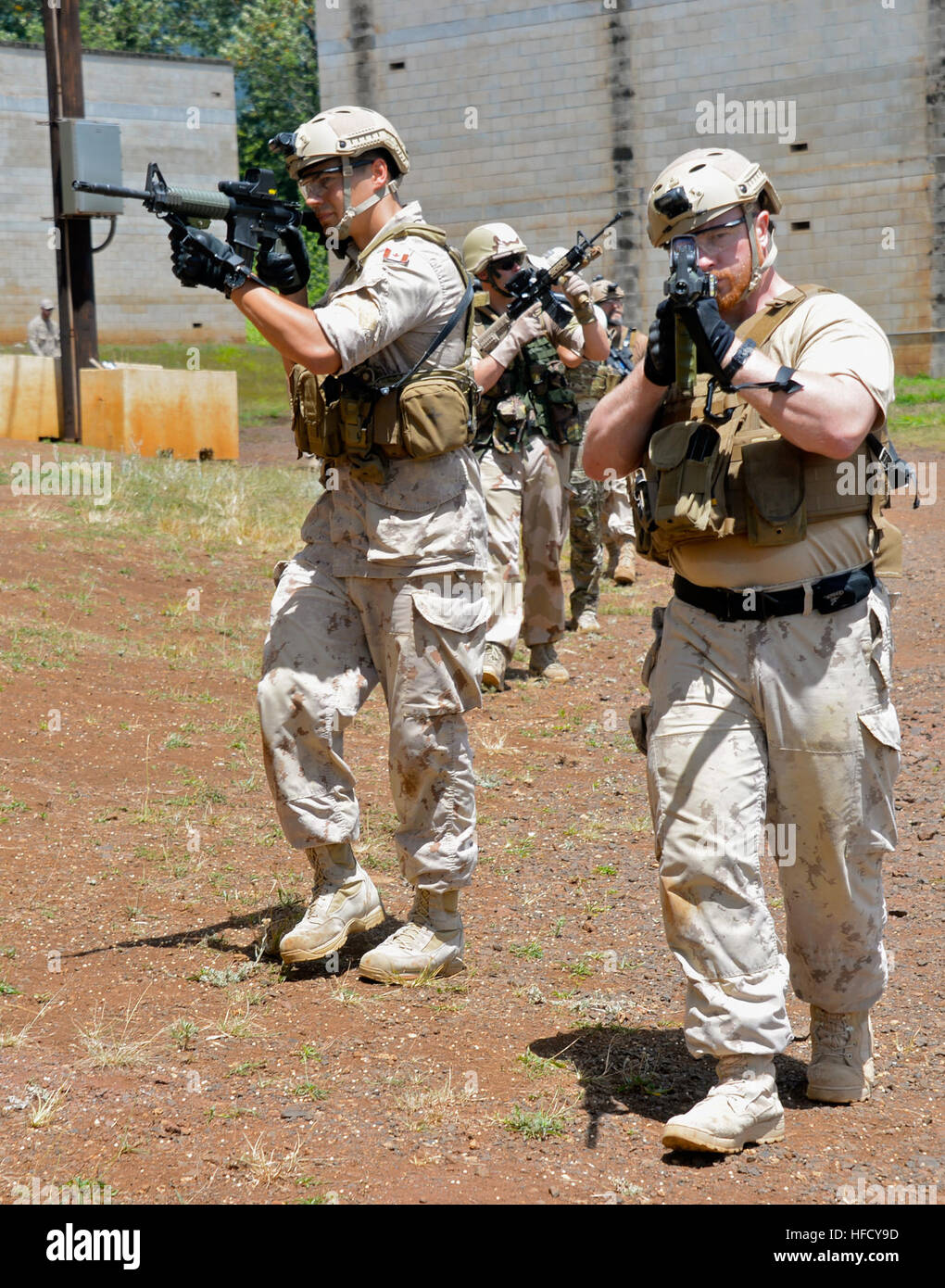 Royal Canadian Navy Clearance Diver Leading Seaman Cole Wood (left) and Leading Seaman Donny Allen, both assigned to Fleet Diving Unit Pacific, participate in room clearing exercises during Rim of the Pacific (RIMPAC) Exercise 2014. Twenty-two nations, 49 ships and submarines, more than 200 aircraft and 25,000 personnel are participating in RIMPAC from June 26 to Aug. 1 in and around the Hawaiian Islands and Southern California. The world's largest international maritime exercise, RIMPAC provides a unique training opportunity that helps participants foster and sustain the cooperative relations Stock Photo