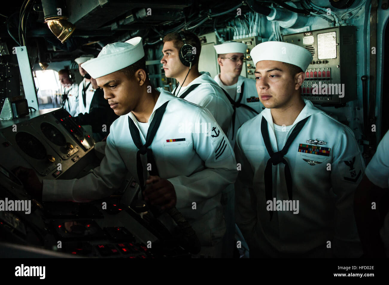 Helmsman aboard USS Boxer (LHD 4) stands watch on the bridge as the ...