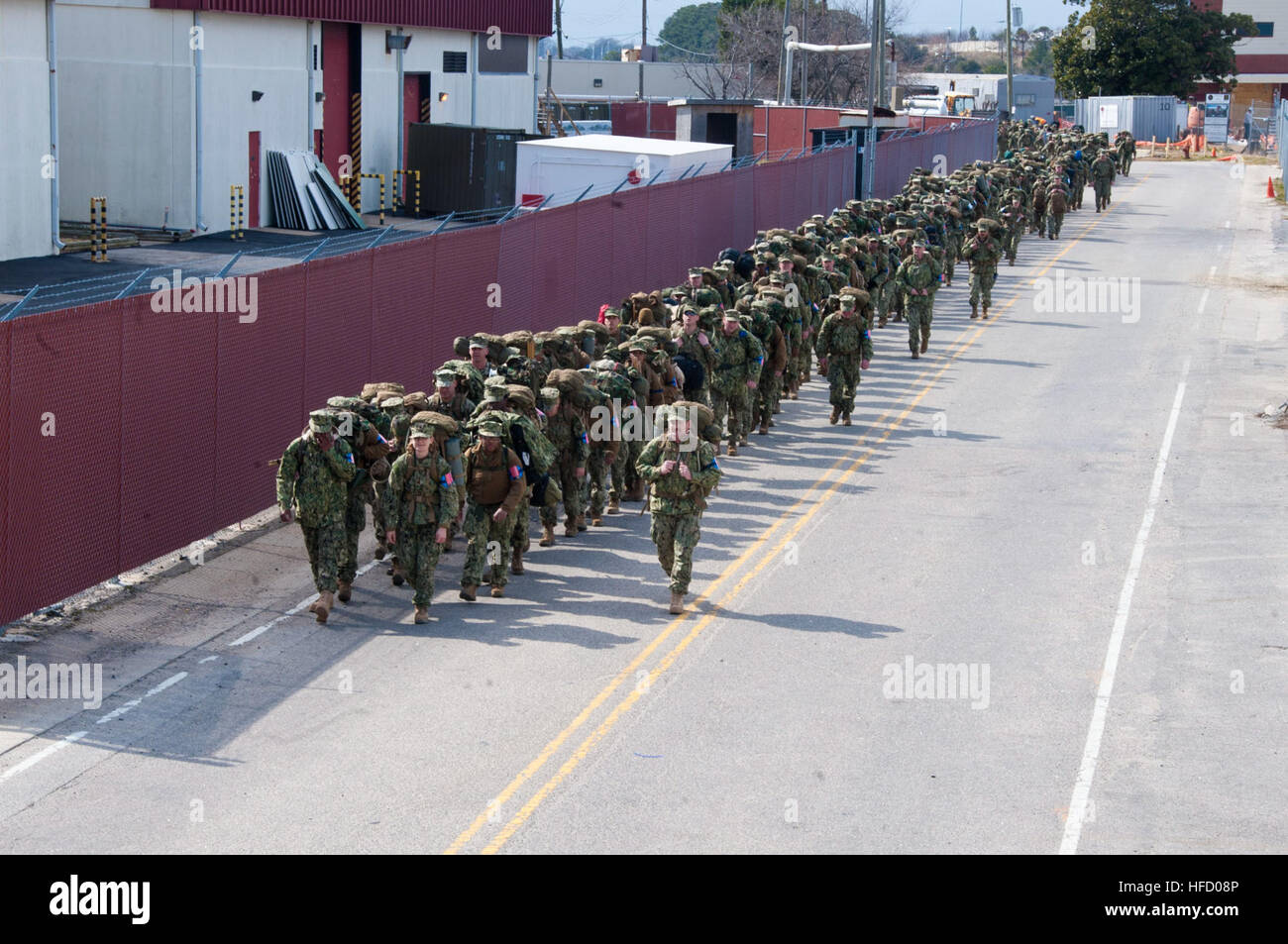 Sailors assigned to Amphibious Construction Battalion 2 march in column formation during a five-mile march at Joint Expeditionary Base Little Creek-Fort Story. (U.S. Navy photo by Mass Communication Specialist 2nd Class  Jonathan Pankau/Released) Sailors conduct 5-mile march 130305-N-CV877-036 Stock Photo