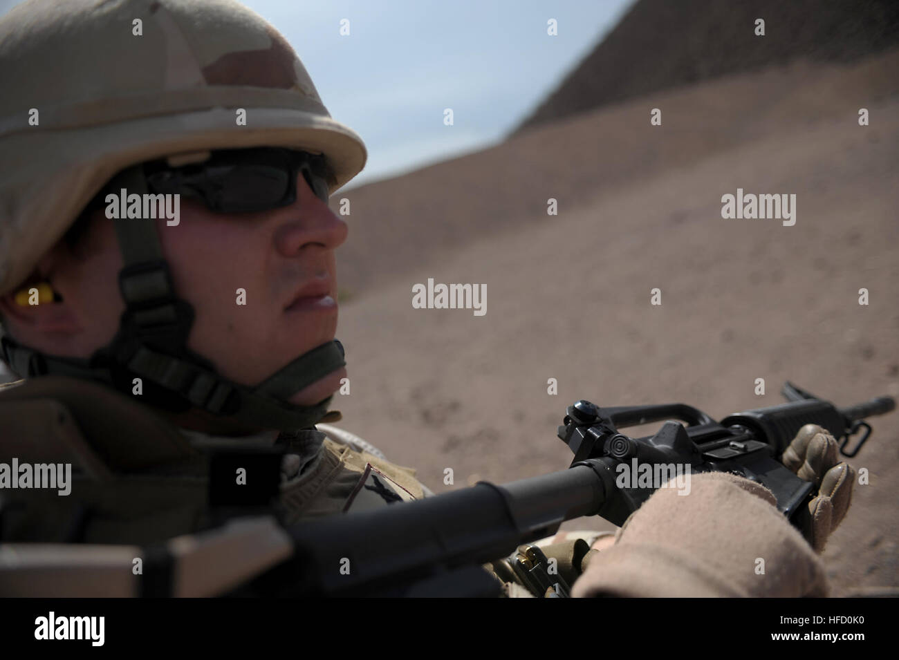 Petty Officer 3rd Class Bryan Silveri, Naval Mobile Construction Battalion 74 armorer, attends a familiarization range near Djibouti City, Djibouti, June 4. Silveri is currently on a six month deployment to Combined Joint Task Force-Horn of Africa. Sailors hone weapon skills in African desert 93441 Stock Photo