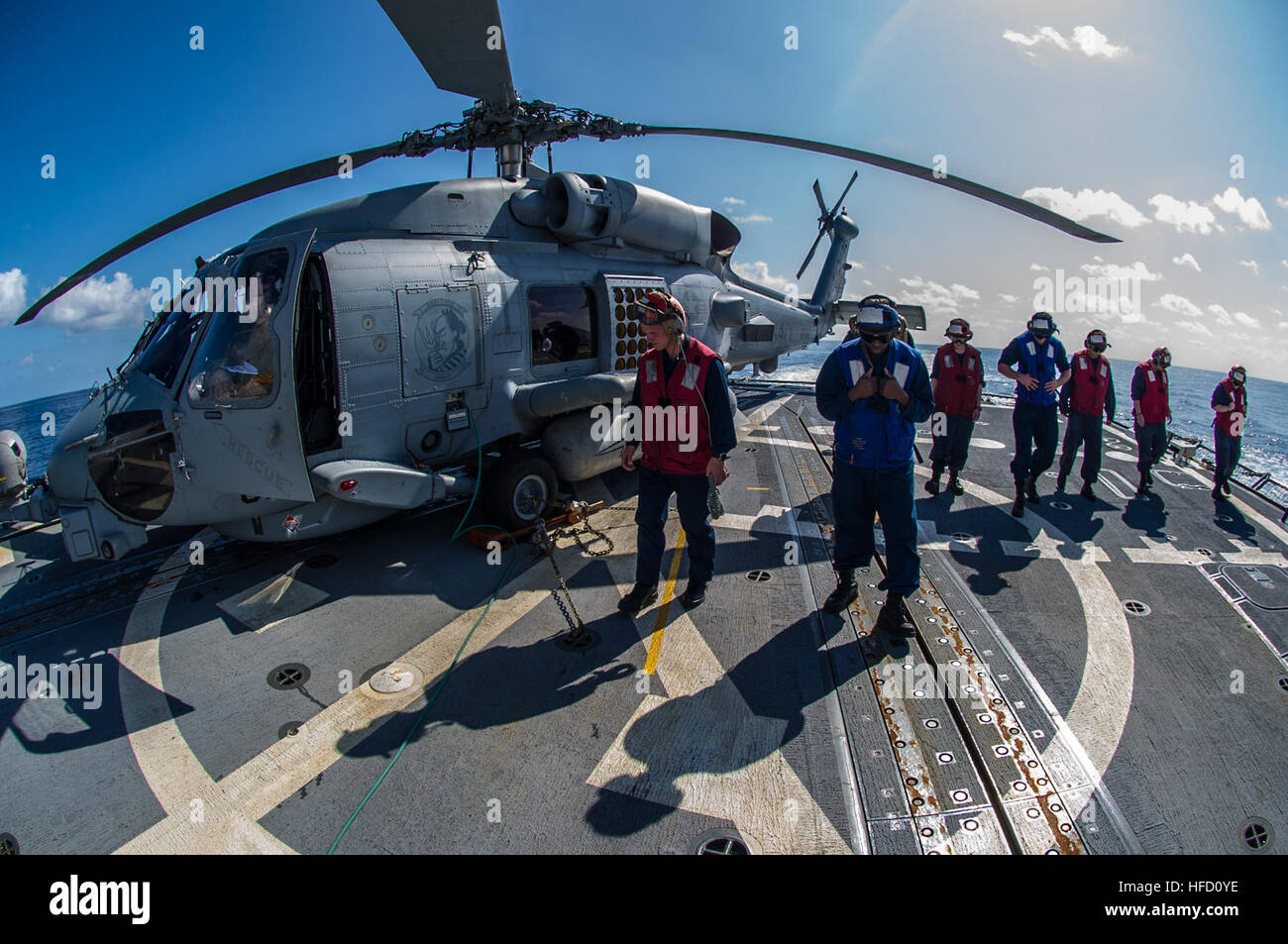 PACIFIC OCEAN (Jan. 30, 2014) Sailors perform a foreign object debris (FOD) walk down on the flight deck of the Arleigh Burke-class guided-missile destroyer USS McCampbell (DDG 85). McCampbell is on patrol in the U.S. 7th Fleet area of responsibility supporting security and stability in the Indo-Asia-Pacific region. (U.S. Navy photo by Mass Communication Specialist 3rd Class Chris Cavagnaro/Released) 140130-N-IP531-031  Join the conversation http://www.facebook.com/USNavy http://www.twitter.com/USNavy http://navylive.dodlive.mil Sailors perform FOD walk down aboard USS McCampbell. (12239037956 Stock Photo