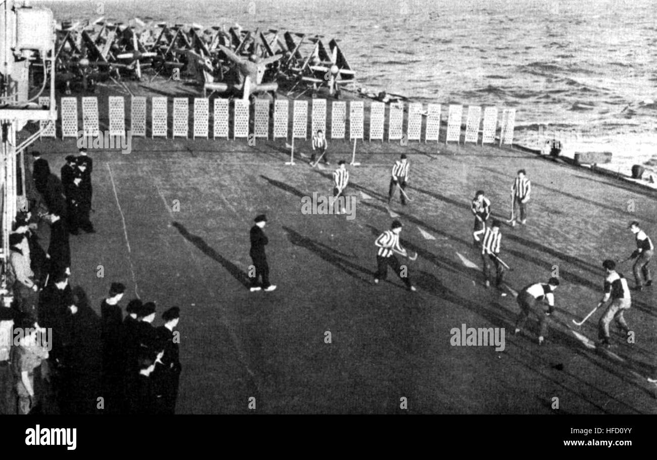 Sailors playing hockey on HMCS Magnificent (CVL 21) c1948 Stock Photo ...