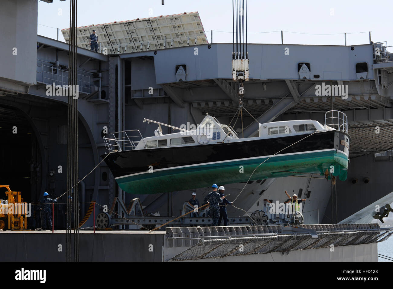 U.S. Navy Carrier Strike Group 11's admiral's barge hangs in mid-air as ...