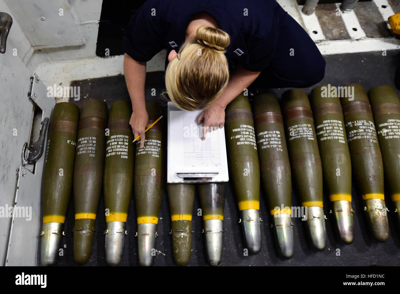 SOUDA BAY, Greece (Sept. 7, 2016) Lt. Carleigh Gregory from Herndon, Va., takes inventory of 5 inch ammunition aboard USS Ross (DDG 71) Sept. 7, 2016.  Ross, an Arleigh Burke-class guided-missile destroyer, forward-deployed to Rota, Spain, is conducting naval operations in the U.S. 6th Fleet Area of Operations in support of U.S. national security interests in Europe and Africa. (U.S. Navy photo by Mass Communication Specialist 1st Class Theron J. Godbold/Released160907-N-FP878-026 Join the conversation: http://www.navy.mil/viewGallery.asp http://www.facebook.com/USNavy http://www.twitter.com/U Stock Photo