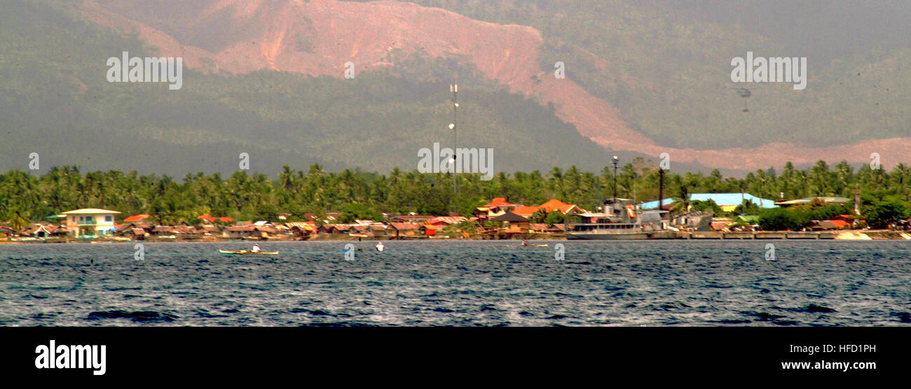 Small fishing villages line the coastline near Cabalian Bay ...