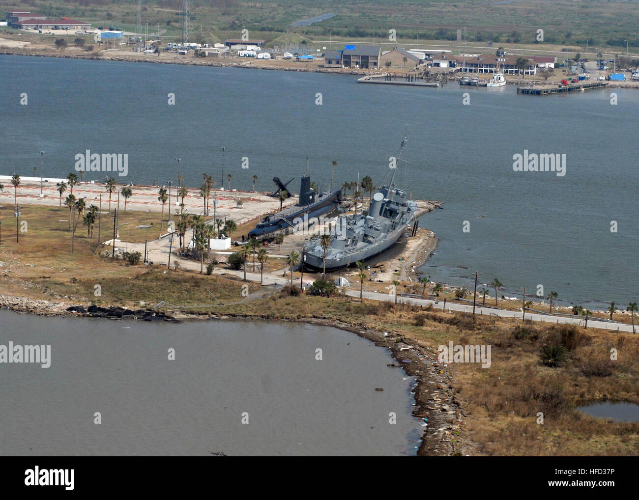 080919-N-6575H-603 GALVESTON, Texas (Sept. 19, 2008) The Edsall-class destroyer escort Stewart (DE 238) and the Gato-class submarine Cavalla (SS 244), both museum ships at Seawolf Park on Pelican Island in Galveston, Texas, are shown entirety on land. The floating museums were carried off their moorings during Hurricane Ike’s storm surge. (U.S. Navy photo by Chief Mass Communication Specialist Chris Hoffpauir/Released) Seawolf Park damage following Ike Stock Photo