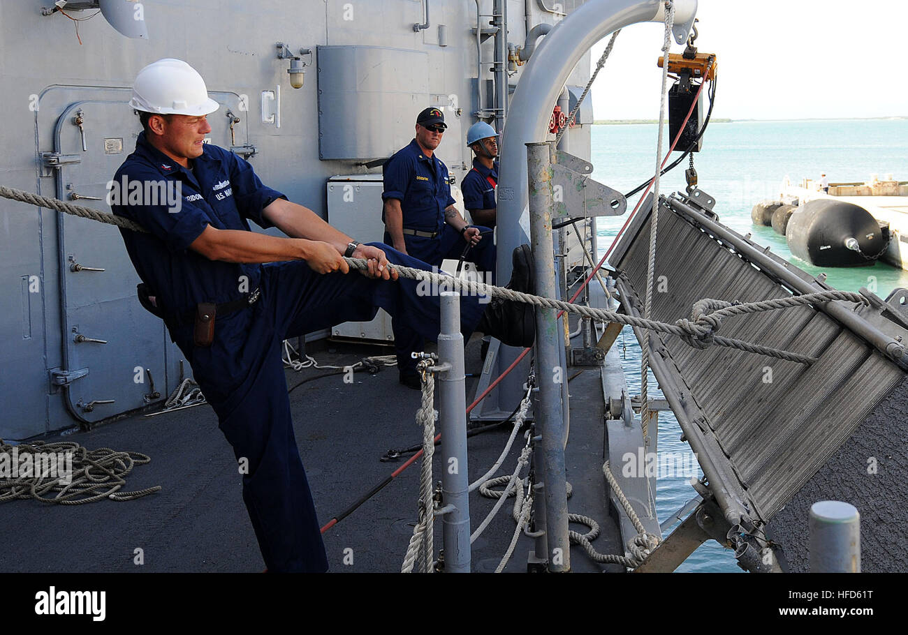 U.S. Navy Boatswain's Mate 1st Class Dmitry Spiridonov, foreground