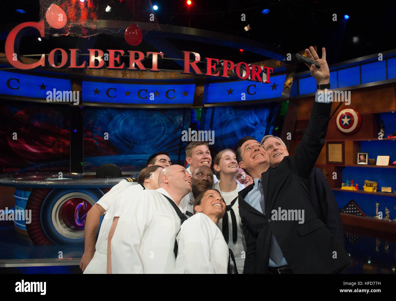 NEW YORK (May 22, 2014) Secretary of the Navy (SECNAV) Ray Mabus and Stephen Colbert, host of the late night television show “The Colbert Report” take a selfie photograph with Sailors during Fleet Week 2014 in New York City. (U.S. Navy photo by Mass Communication Specialist 1st Class Arif Patani/Released) 140522-N-PM781-006 Join the conversation http://www.navy.mil/viewGallery.asp http://www.facebook.com/USNavy http://www.twitter.com/USNavy http://navylive.dodlive.mil http://pinterest.com https://plus.google.com Stephen Colbert takes a selfie with a Sailor. (14066471618) Stock Photo