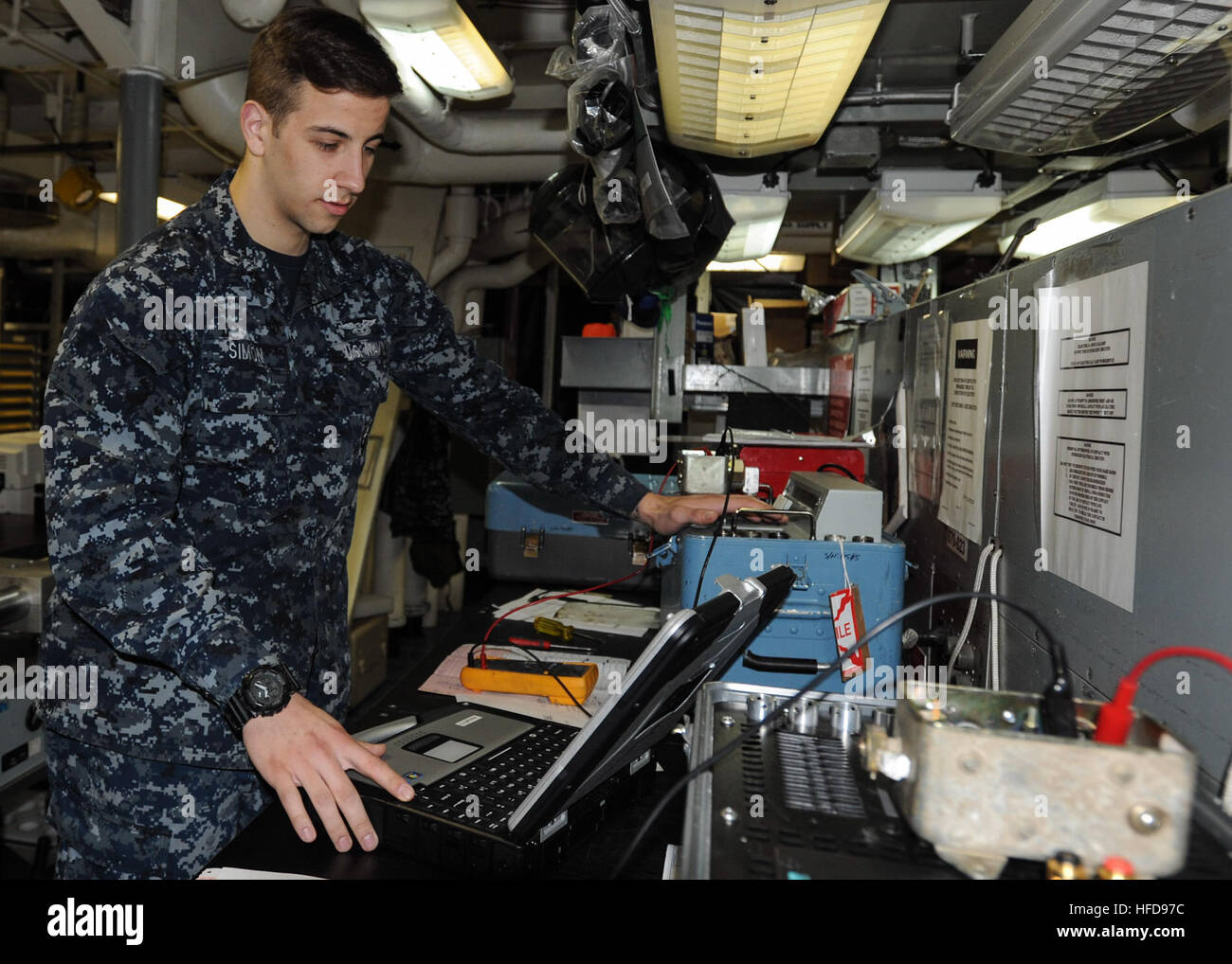 U.S. Navy Aviation Boatswain's Mate (Fuels) 3rd Class Daniel Simon runs ...