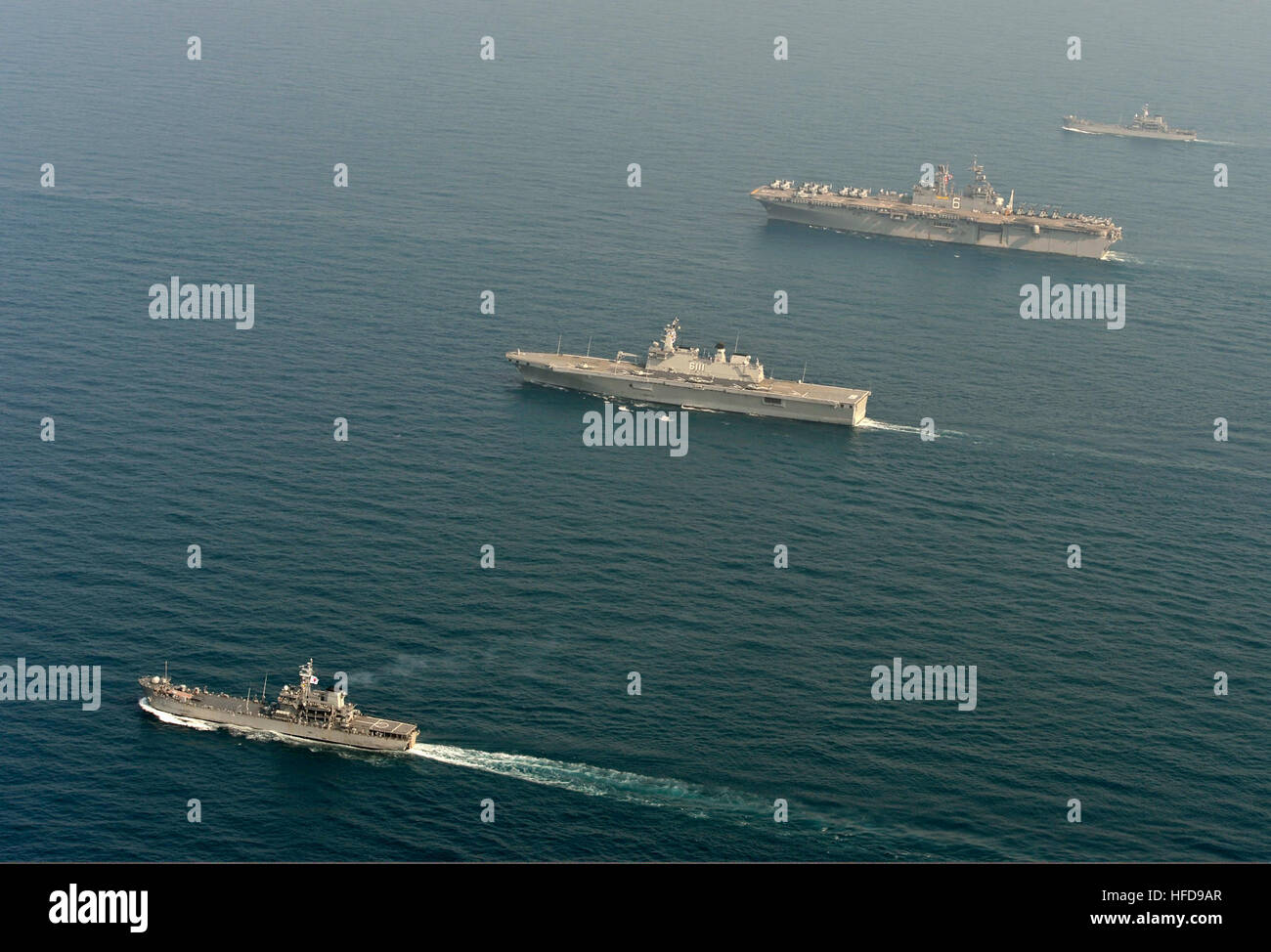 The amphibious assault ship USS Bonhomme Richard (LHD 6), second from top right, transits the East China Sea with Republic of Korea Navy ships during a photo exercise March 27, 2014. The Bonhomme Richard was the flagship of the Bonhomme Richard Amphibious Ready Group and was participating in exercise Ssang Yong 14, a combined U.S.-South Korean combat readiness and joint/combined interoperability exercise designed to advance South Korean command and control capabilities through amphibious operations. (U.S. Navy photo by Mass Communication Specialist 2nd Class Michael Achterling/Released) The am Stock Photo