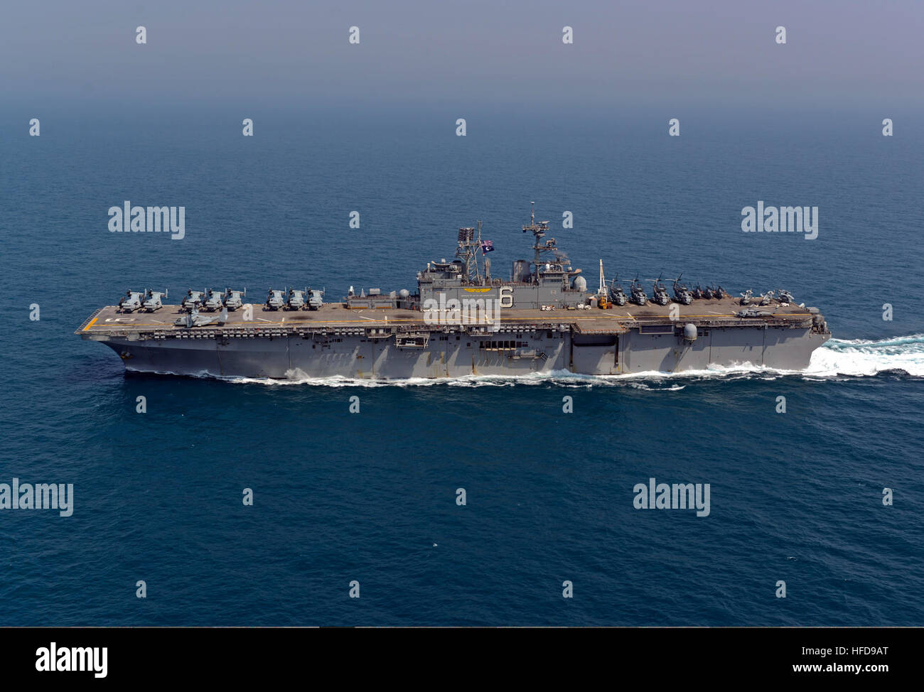 The amphibious assault ship USS Bonhomme Richard (LHD 6) transits the East China Sea during a photo exercise March 27, 2014. The Bonhomme Richard was the flagship of the Bonhomme Richard Amphibious Ready Group and was participating in exercise Ssang Yong 14, a combined U.S.-South Korean combat readiness and joint/combined interoperability exercise designed to advance South Korean command and control capabilities through amphibious operations. (U.S. Navy photo by Mass Communication Specialist 2nd Class Michael Achterling/Released) The amphibious assault ship USS Bonhomme Richard (LHD 6) transit Stock Photo