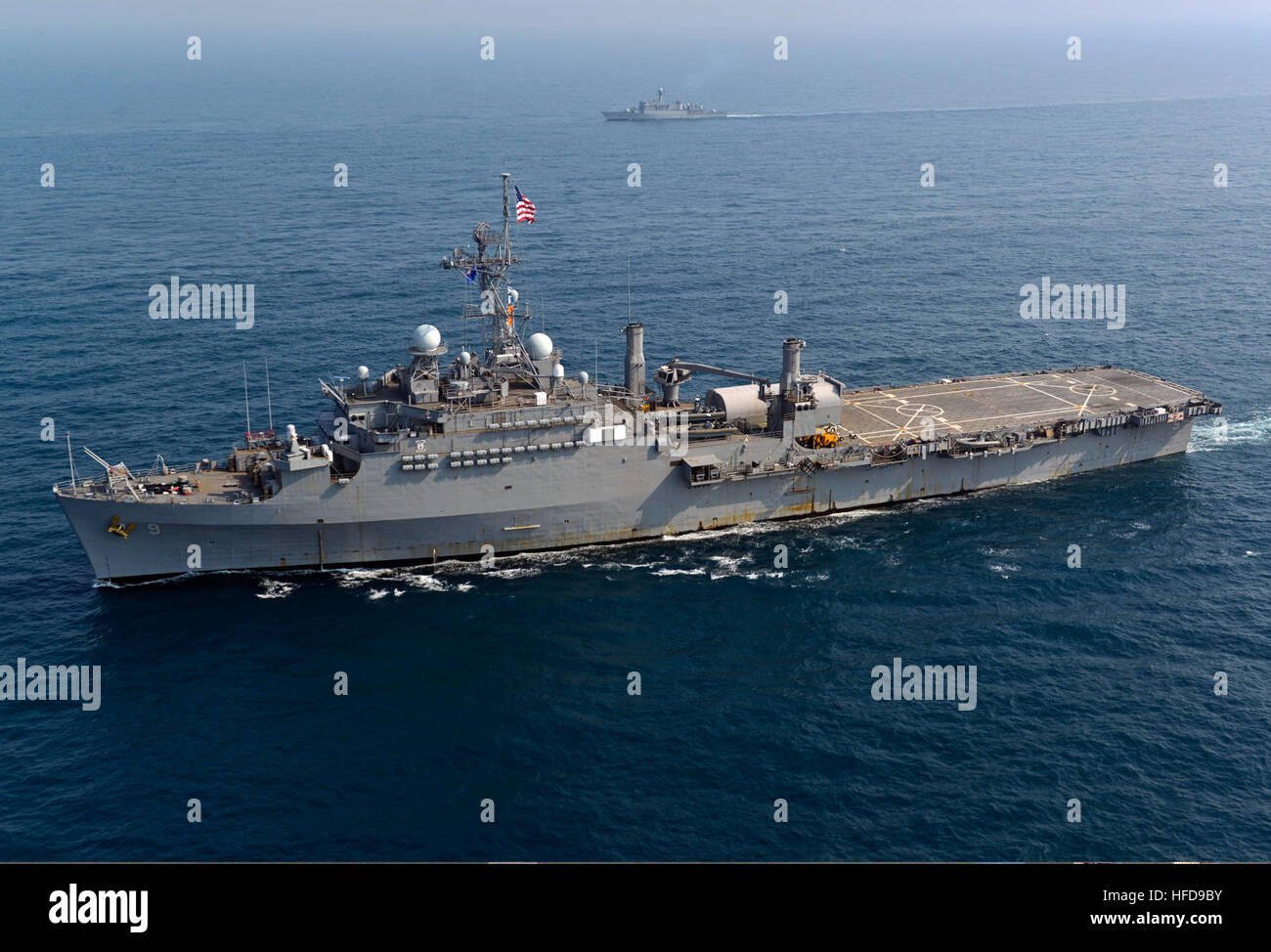 The amphibious transport dock ship USS Denver (LPD 9) and other ships assigned to the Bonhomme Richard Amphibious Ready Group are underway with Republic of Korea Navy ships during a photo exercise in the East China Sea March 27, 2014. The Denver was participating in exercise Ssang Yong 14, a combined U.S.-South Korean combat readiness and joint/combined interoperability exercise designed to advance South Korean command and control capabilities through amphibious operations. (U.S. Navy photo by Mass Communication Specialist 2nd Class Michael Achterling/Released) The amphibious transport dock sh Stock Photo