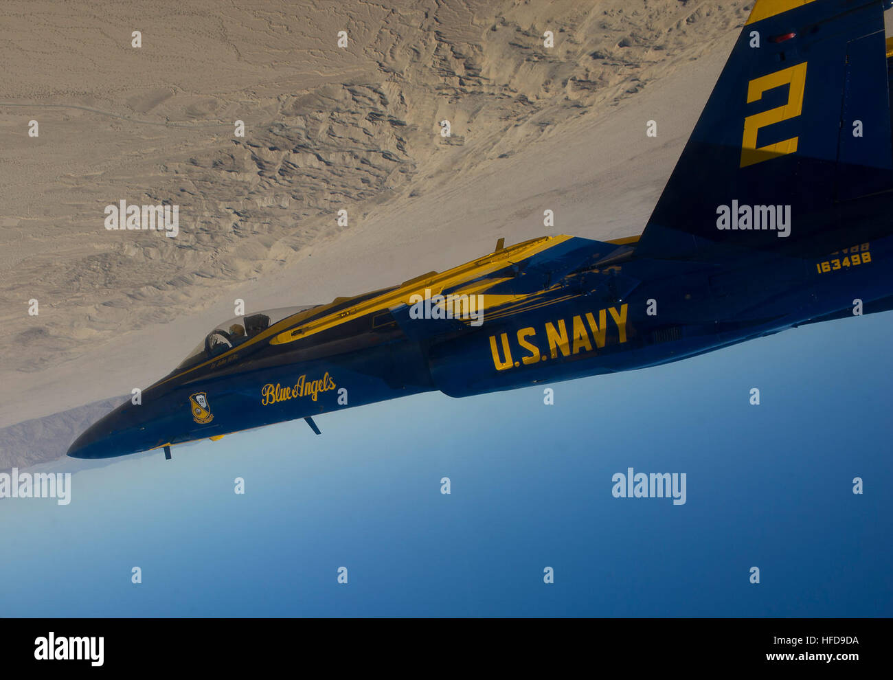 Lt. John Hiltz, from Fort Mitchell, Ky., assigned to the U.S. Navy flight demonstration squadron, the Blue Angels, flies inverted over the desert near Naval Air Facility El Centro, Calif., during a practice flight. The Blue Angels start the 2012 show season at the Naval Air Facility El Centro Air Show March 10. (U.S. Navy photo by: Chief Mass Communication Specialist Russell Tafuri) The Blue Angels fly over El Centro 120224-N-AA791-009 Stock Photo