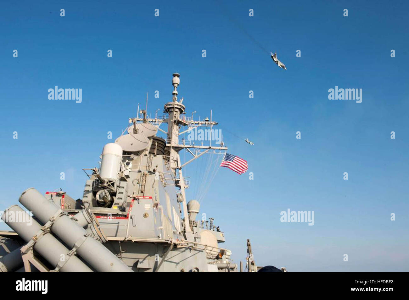 160412-N-00000-009 BALTIC SEA – Two Russian Sukhoi Su-24 attack aircraft fly over the USS Donald Cook (DDG 75) Apr. 12, 2016. Donald Cook, an Arleigh Burke-class guided-missile destroyer, forward deployed to Rota, Spain is conducting a routine patrol in the U.S. 6th Fleet area of operations in support of U.S. national security interests in Europe. (U.S. Navy photo/Released) Two Russian Sukhoi Su-24 fly over the USS Donald Cook (DDG-75) - 160412-N-00000-009 Stock Photo