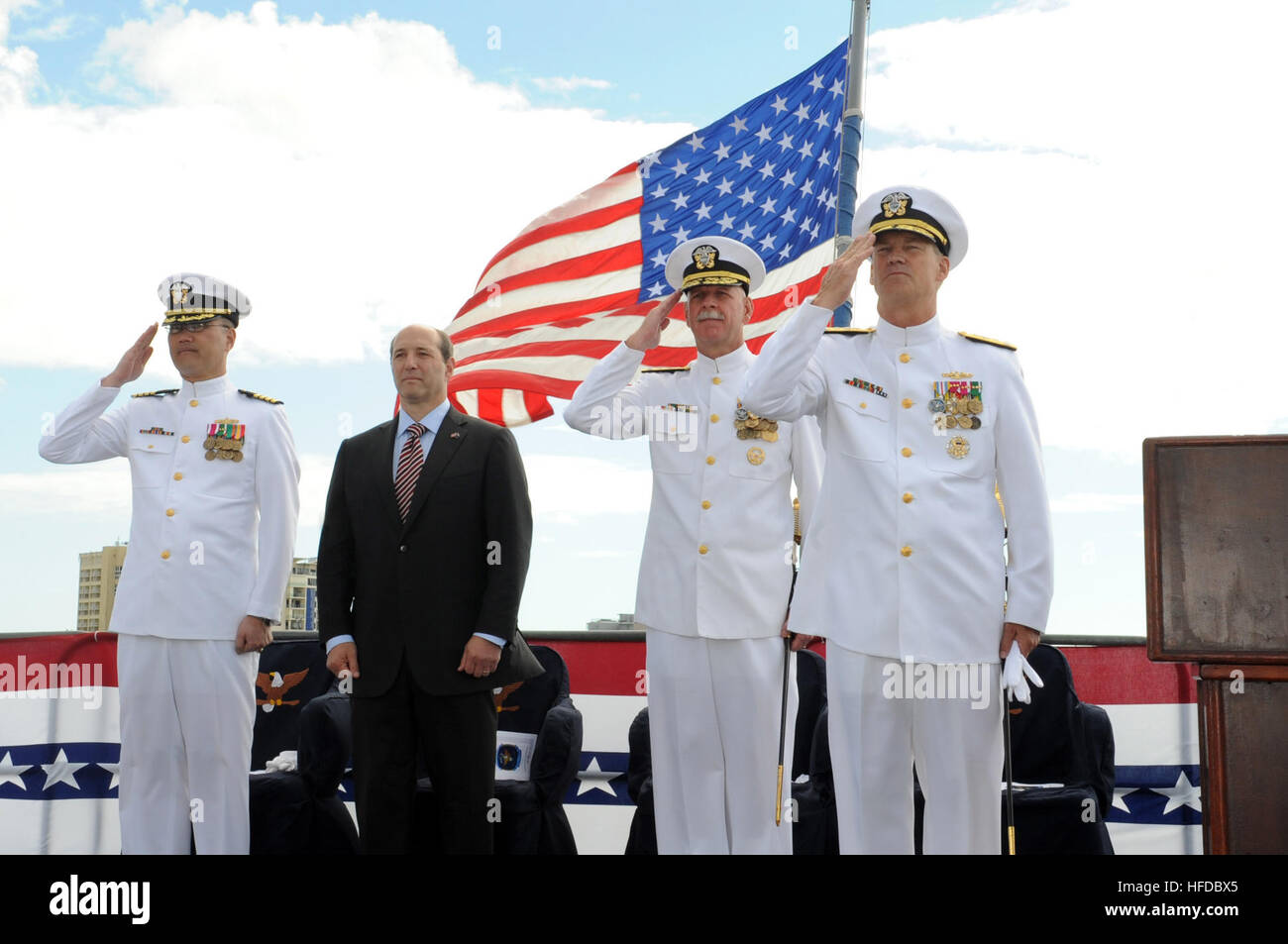 CAIRNS, Australia (July 31, 2013) Vice Adm. Robert L. Thomas Jr., right, salutes after taking command of the U.S. 7th Fleet alongside departing U.S. 7th Fleet commander Vice Adm. Scott H. Swift during a change of command ceremony aboard the U.S. 7th Fleet flagship USS Blue Ridge (LCC 19) in Cairns, Australia. With Thomas and Swift are U.S. Ambassador to Australia Jeffrey Bleich and Capt. John Shimotsu, U.S. 7th Fleet Chaplain. Blue Ridge and embarked U.S. 7th Fleet staff are on patrol operating forward, building maritime partnerships and conducting security and stability operations. (U.S. Navy Stock Photo