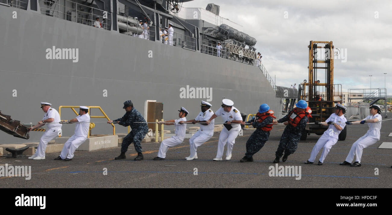 Sailors from the U.S. Navy and the Japan Maritime Self-Defense Force pull the brow on the pier as the Japan Maritime Self-Defense Force training squadron ship JS Kashima (TV 3508) arrives at Joint Base Pearl Harbor-Hickam for a port visit. This year marks the 50th anniversary of the U.S. and Japan Treaty of Mutual Cooperation of Security that in 1960 established the alliance between the two countries. (U.S. Navy photo by Seaman Rachel Swiatnicki/Released) U.S. and Japan Treaty of Mutual Cooperation of Securit 288921 Stock Photo