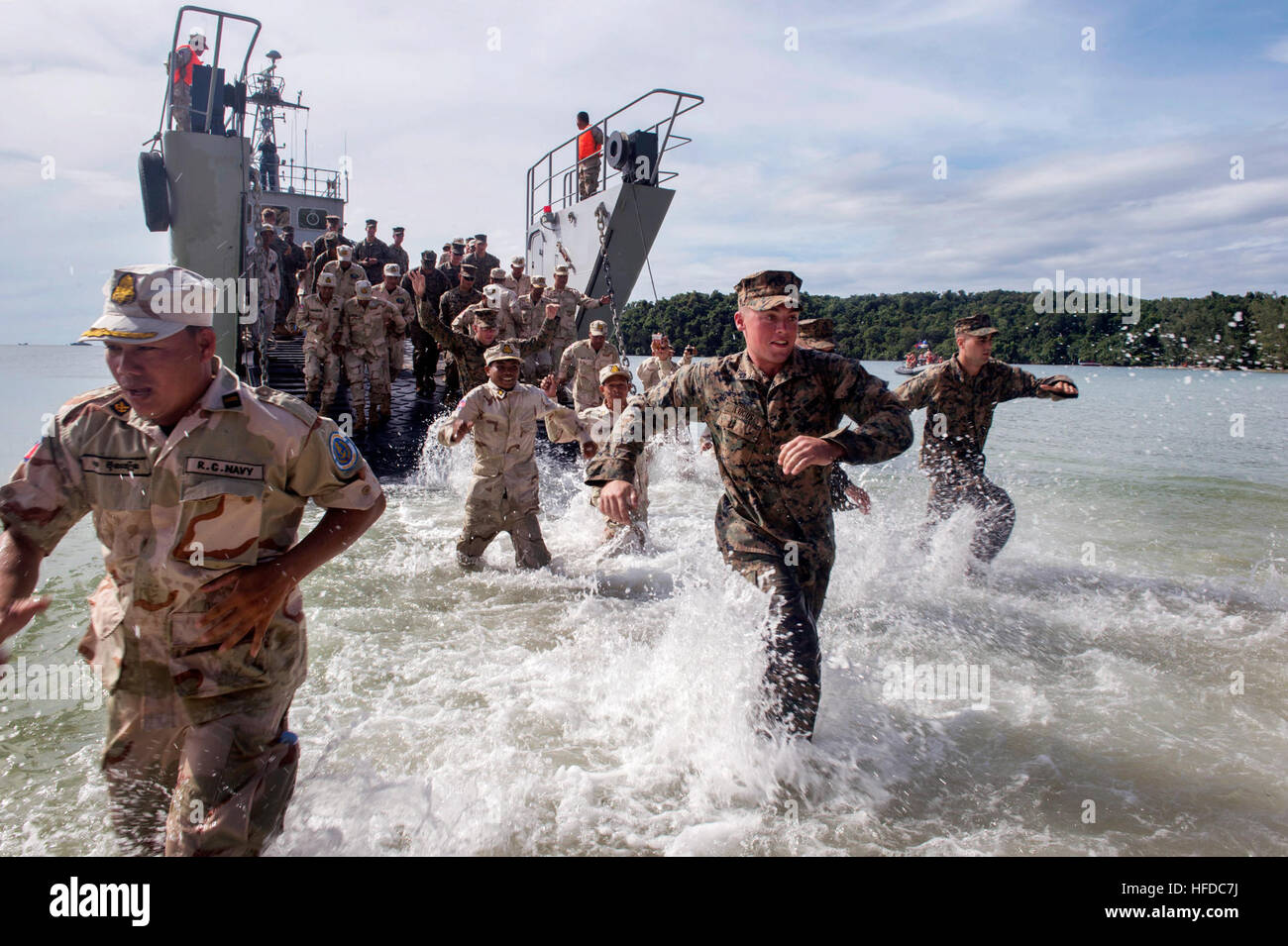 SIHANOUKVILLE, Cambodia (Nov. 3, 2016) - U.S. Marines, from 3rd Battalion, 2nd Marine Regiment, Seabees, from Naval Mobile Construction Battalion (NMCB) 5, and Royal Cambodian Navy (RCN) sailors disembark an RCN amphibious landing craft during a field training exercise for Cooperation Afloat Readiness and Training (CARAT) Cambodia, 2016. CARAT is a series of annual maritime exercises between the U.S. Navy, U.S. Marine Corps, and the armed forces of nine partner nations to include Bangladesh, Brunei, Cambodia, Indonesia, Malaysia, the Philippines, Singapore, Thailand, and Timor-Leste. (U.S. Nav Stock Photo
