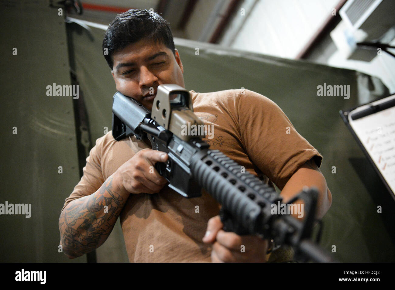 Task Force 56 A U.S. Navy sailor assigned to Task Force 56 performs a function check ...