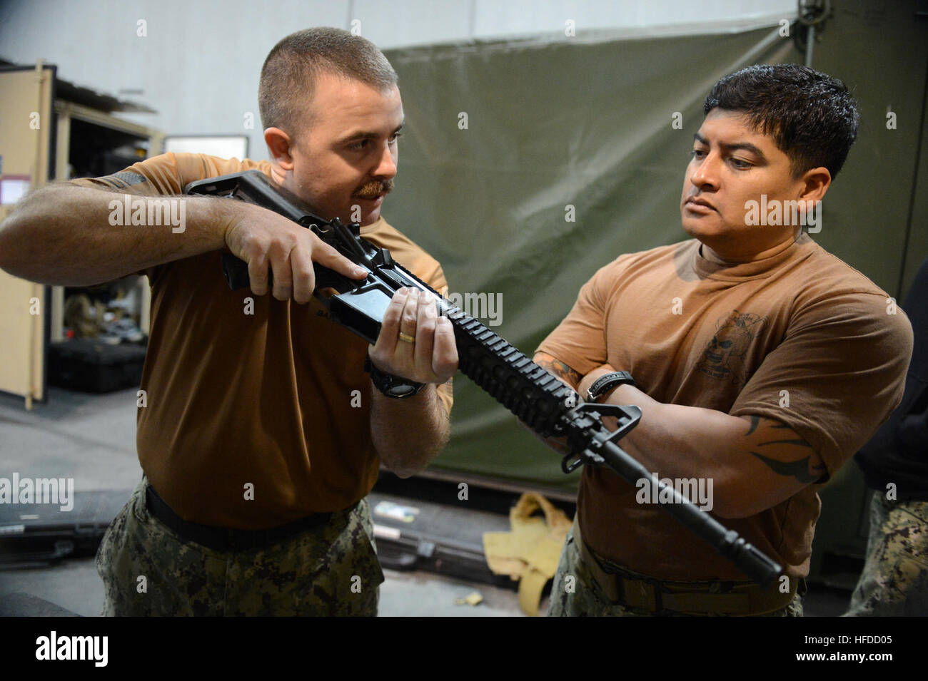 Task Force 56 U.S. Navy Electronics Technician and Boatswain's Mate assigned to ...
