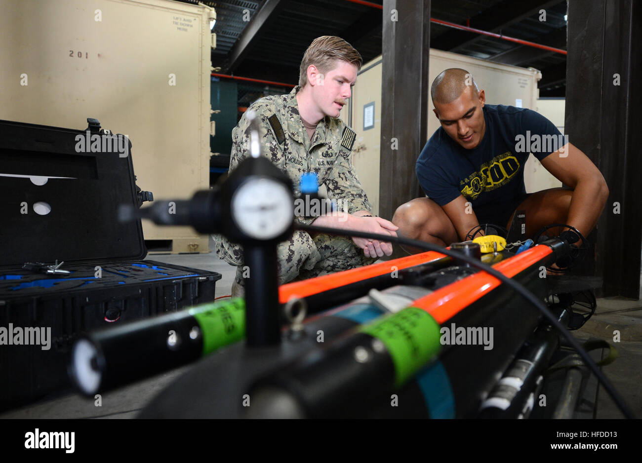 U.S. Navy Explosive Ordnance Disposal (EOD) Technician 2nd Class Michael Ganousis, left, and EOD Technician 3rd Class Troy Padmore, both assigned to a mine countermeasures team with Commander, Task Group (CTG) 56.1, conduct training on an Atlas Elektronik SeaFox ordnance disposal system at Naval Support Activity Bahrain in Manama, Bahrain, Feb. 9, 2014. CTG-56.1 conducted mine countermeasures, explosive ordnance disposal, salvage diving and force protection operations throughout the U.S. 5th Fleet area of responsibility. (U.S. Navy photo by Mass Communication Specialist 1st Class Michelle L. T Stock Photo
