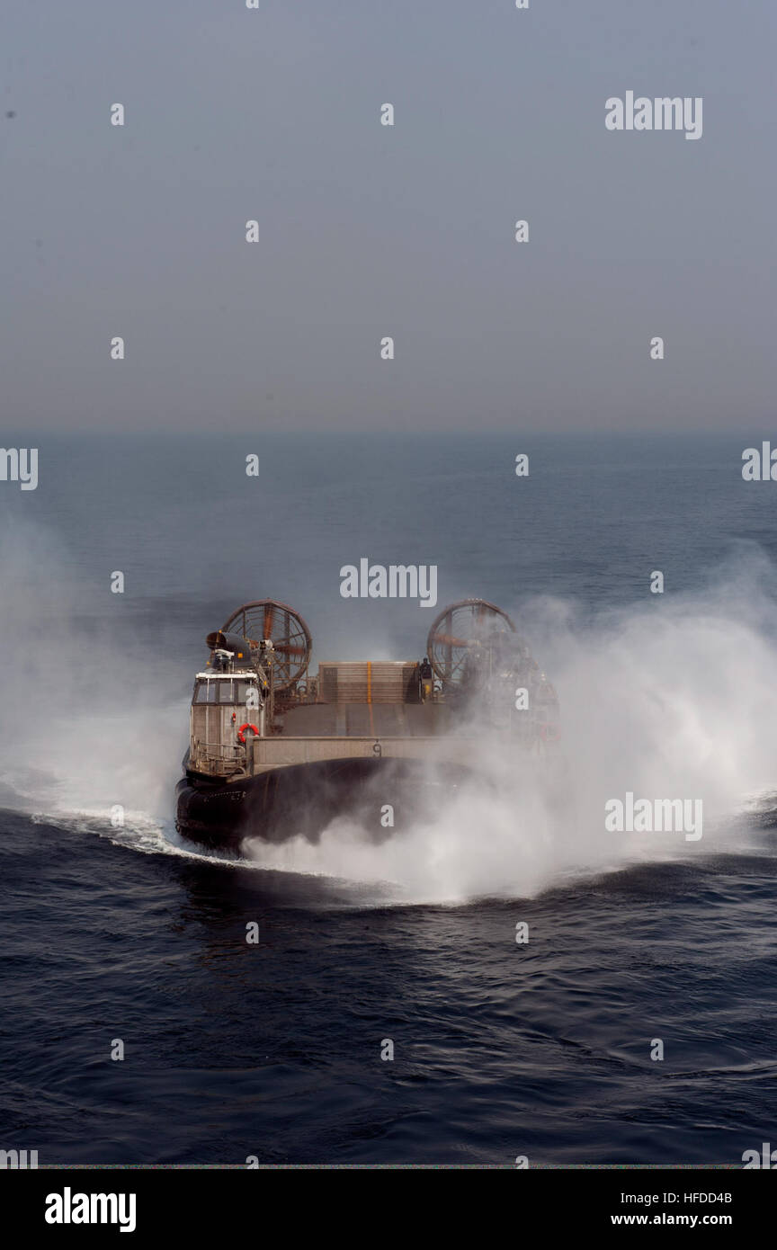U.S. Navy Landing Craft, Air Cushion 9, assigned to Naval Beach Unit 7, prepares to enter the well deck of the amphibious assault ship USS Bonhomme Richard (LHD 6) in the East China Sea during Ssang Yong 14 as part of Marine Expeditionary Force Exercise (MEFEX) 2014 April 2, 2014. The Bonhomme Richard was assigned to Expeditionary Strike Group 7 and participated in MEFEX 2014, a U.S. Marine Corps Forces Pacific-sponsored series of exercises between the U.S. Navy and Marine Corps and South Korean forces. Among the exercises were the Korean Marine Exchange Program, Freedom Banner 14, Ssang Yong  Stock Photo