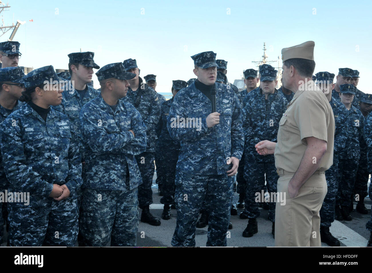 U.S. Navy Vice Adm. Bill Moran, foreground right, the chief of naval personnel, listens to a question from Hospital Corpsman 1st Class Jessie Newton, center right, aboard the amphibious transport dock ship USS New York (LPD 21) at Naval Station Mayport, Fla., Jan. 17, 2014. The naval station was the New York?s new home port after the ship was reassigned from Naval Station Norfolk, Va., as part of a larger move of the Iwo Jima Amphibious Ready Group. (U.S. Navy photo by Mass Communication Specialist 3rd Class Angus Beckles/Released) U.S. Navy Vice Adm. Bill Moran, foreground right, the chief of Stock Photo