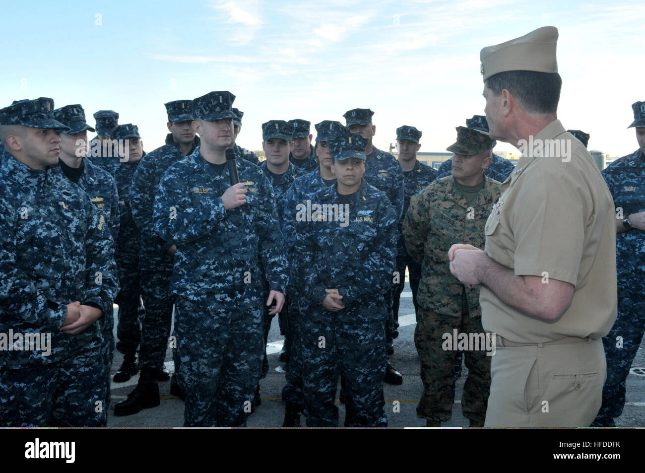 U.S. Navy Vice Adm. Bill Moran, foreground right, the chief of naval personnel, listens to a question from Lt. j.g. Daniel Giller, center left, aboard the amphibious transport dock ship USS New York (LPD 21) at Naval Station Mayport, Fla., Jan. 17, 2014. The naval station was the New York?s new home port after the ship was reassigned from Naval Station Norfolk, Va., as part of a larger move of the Iwo Jima Amphibious Ready Group. (U.S. Navy photo by Mass Communication Specialist 3rd Class Angus Beckles/Released) U.S. Navy Vice Adm. Bill Moran, foreground right, the chief of naval personnel, li Stock Photo