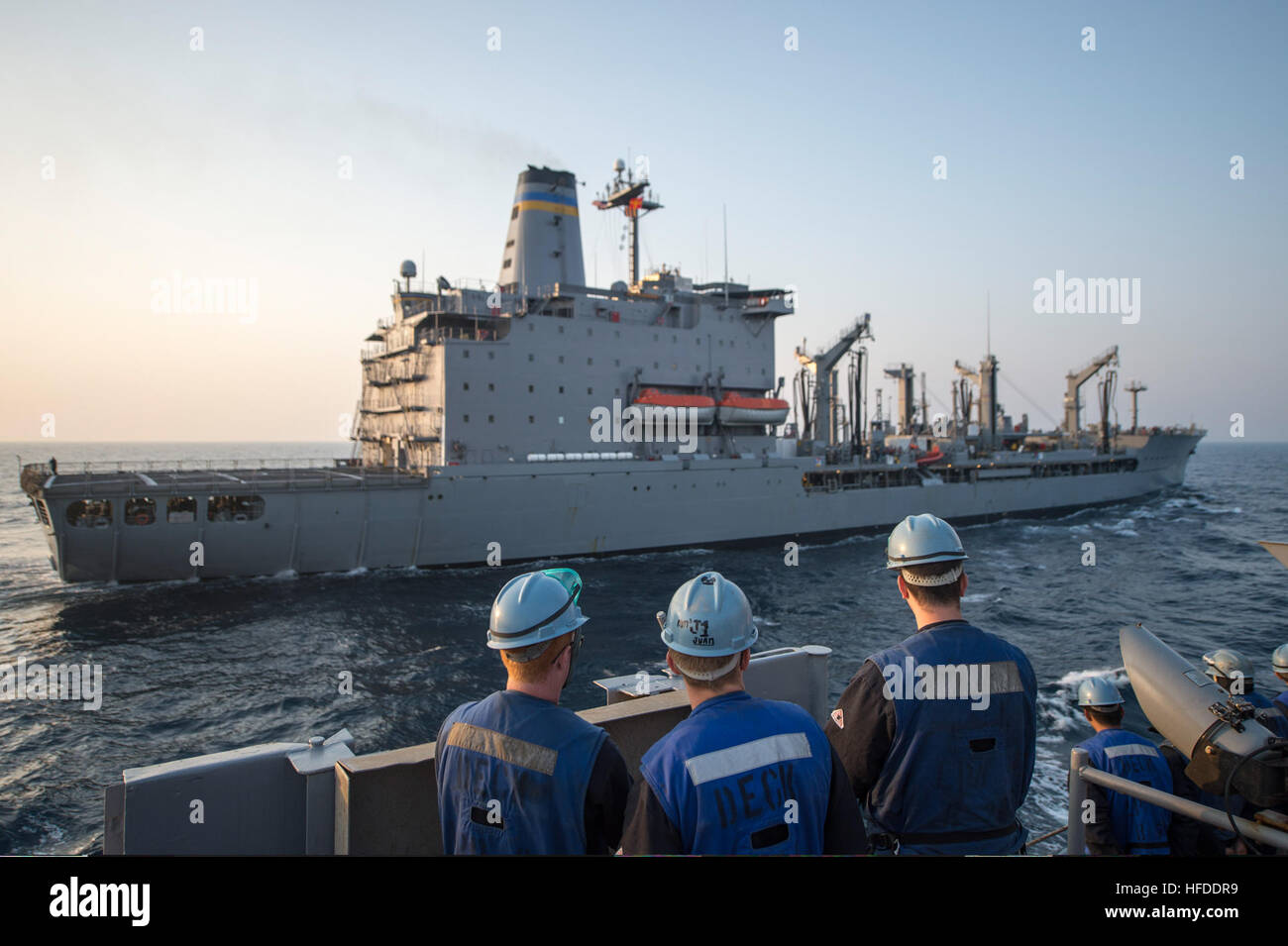 U.S. Sailors assigned to the amphibious transport dock ship USS Denver (LPD 9) stand by before conducting a replenishment at sea with the fleet replenishment oiler USNS Rappahannock (T-AO 204) in the East China Sea March 27, 2014. The Denver was part of the Bonhomme Richard Amphibious Ready Group and was participating in exercise Ssang Yong 14, a combined U.S.-South Korean combat readiness and joint/combined interoperability exercise designed to advance South Korean command and control capabilities through amphibious operations. (U.S. Navy photo by Mass Communication Specialist 3rd Class Todd  Stock Photo