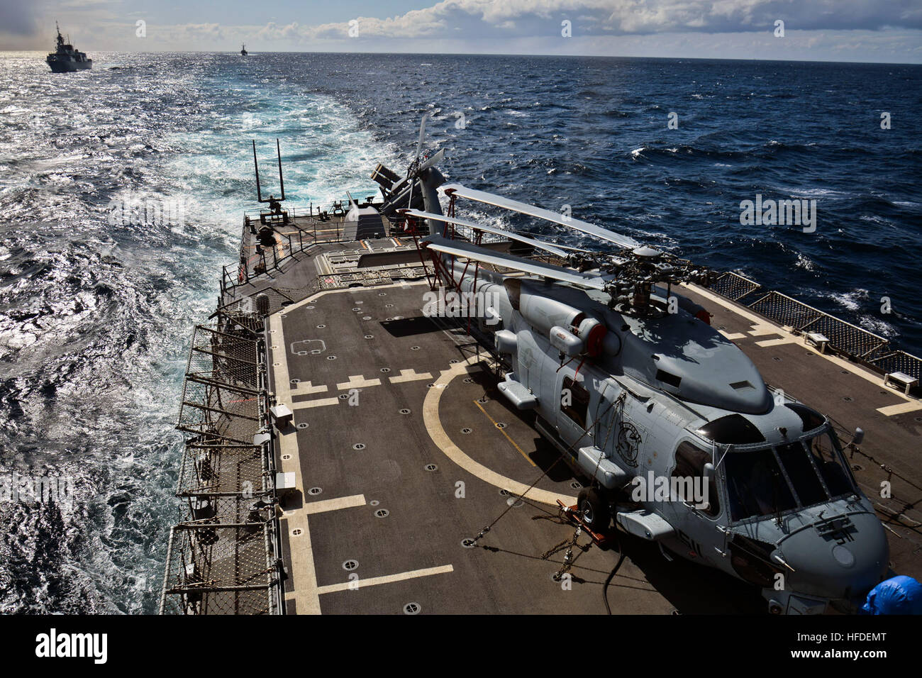 150430-N-IY633-077 ATLANTIC OCEAN (April 30, 2015) - An MH-60R Seahawk helicopter assigned to the Vipers of Helicopter Maritime Strike Squadron 48, Detachment Three, embarked aboard Standing NATO Maritime Group 2 (SNMG2) flagship USS Vicksburg (CG 69), sits on the ship's flight deck during an underway replenishment evolution among SNMG2 ships. SNMG2 is currently deployed to the Atlantic participating in a series of exercises designed to improve interoperability among NATO and non-NATO maritime forces. (U.S. Navy photo by Mass Communication Specialist 2nd Class Amanda S. Kitchner/Released) Unde Stock Photo