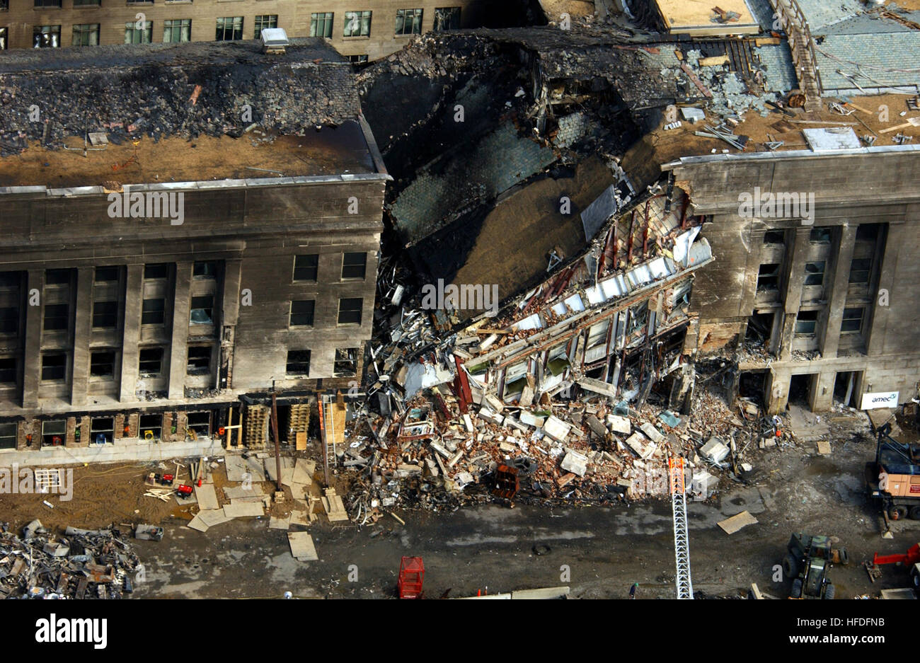 010914-F-8006R-001  This aerial photograph shot on Sept. 14, 2001, shows some of the destruction caused when the high-jacked American Airlines flight slammed into the Pentagon on Sept. 11.  The terrorist attack caused extensive damage to the west face of the building and followed similar attacks on the twin towers of the World Trade Center in New York City.   DoD photograph by Tech. Sgt. Cedric H. Rudisill.  (Released) US Navy 010914-F-8006R-001 aerial view of Pentagon destruction Stock Photo